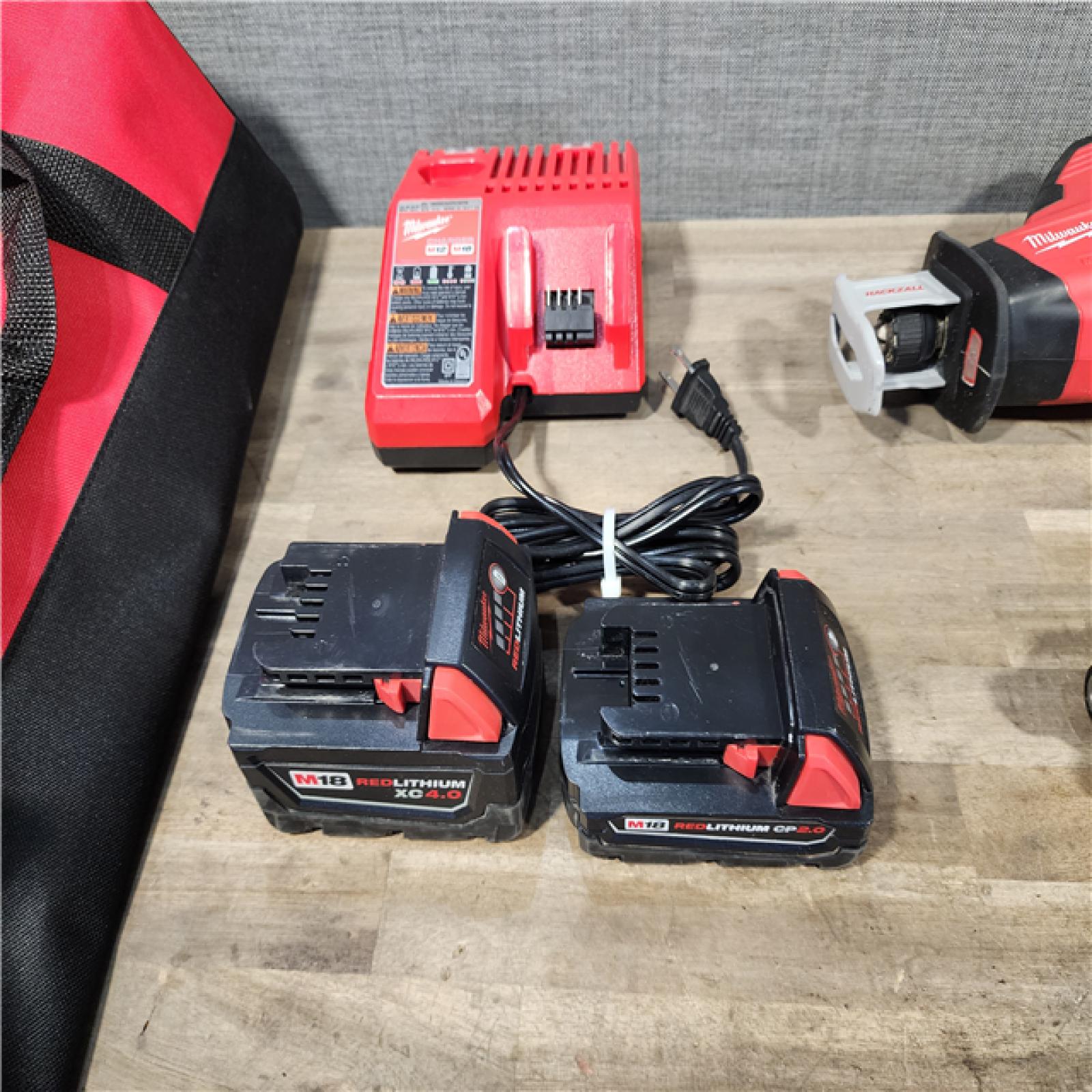 HOUSTON LOCATION - AS-IS MILWAUKEE 3 TOOL COMBO KIT W/ (2) BATTERY & CHARGER