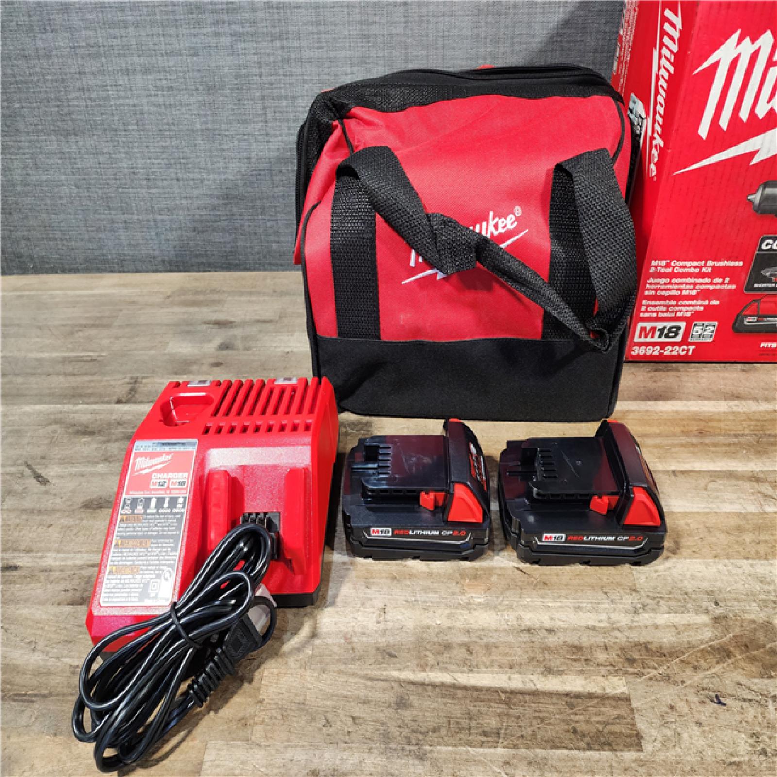 HOUSTON LOCATION - AS-IS Milwaukee M18 18V Lithium-Ion Brushless Cordless Compact Drill/Impact Combo Kit (2-Tool) W/(2) 2.0 Ah Batteries  Charger & Bag