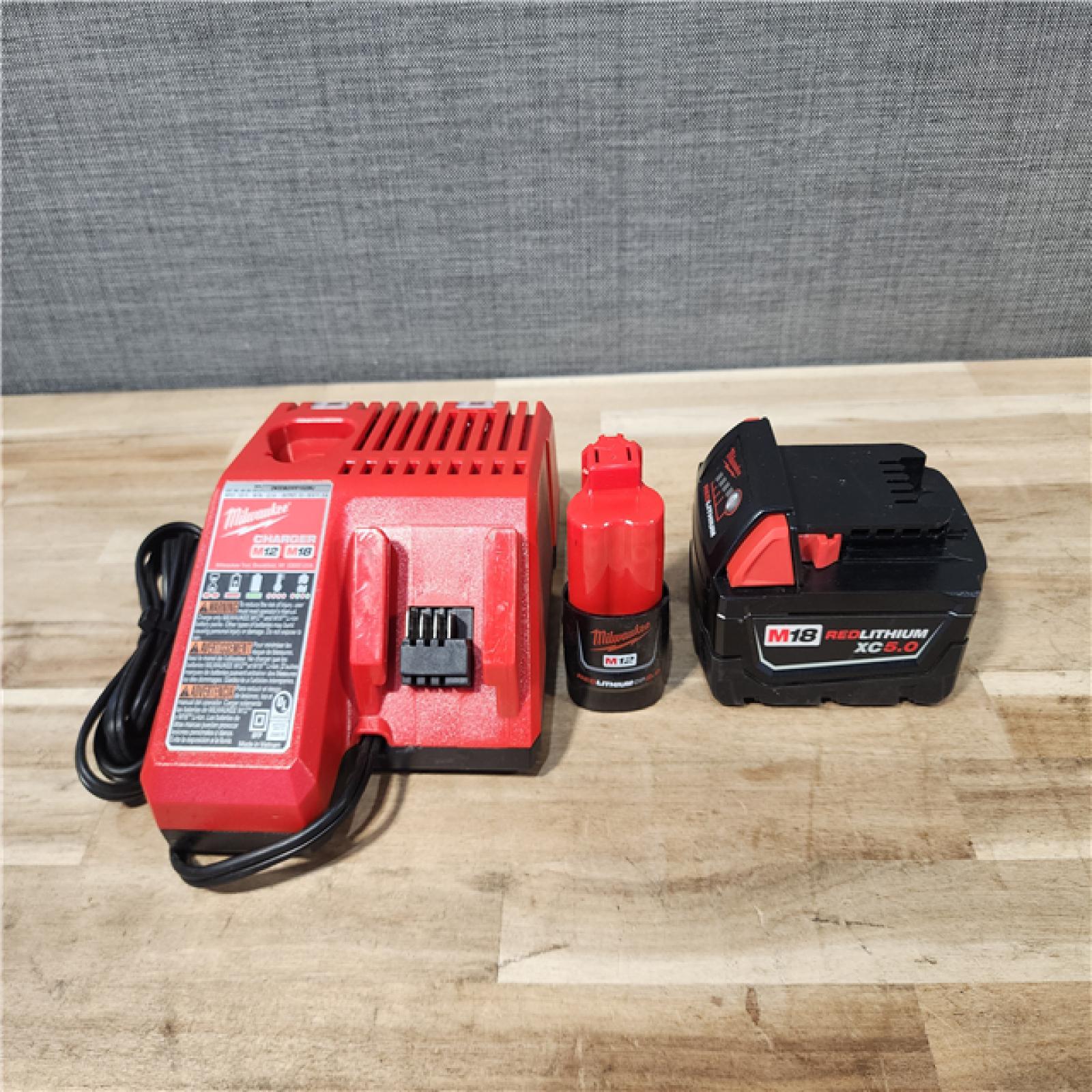 HOUSTON LOCATION - AS-IS MILWAUKEE 2 TOOL COMBO KIT W/ (2) BATTERY & CHARGER