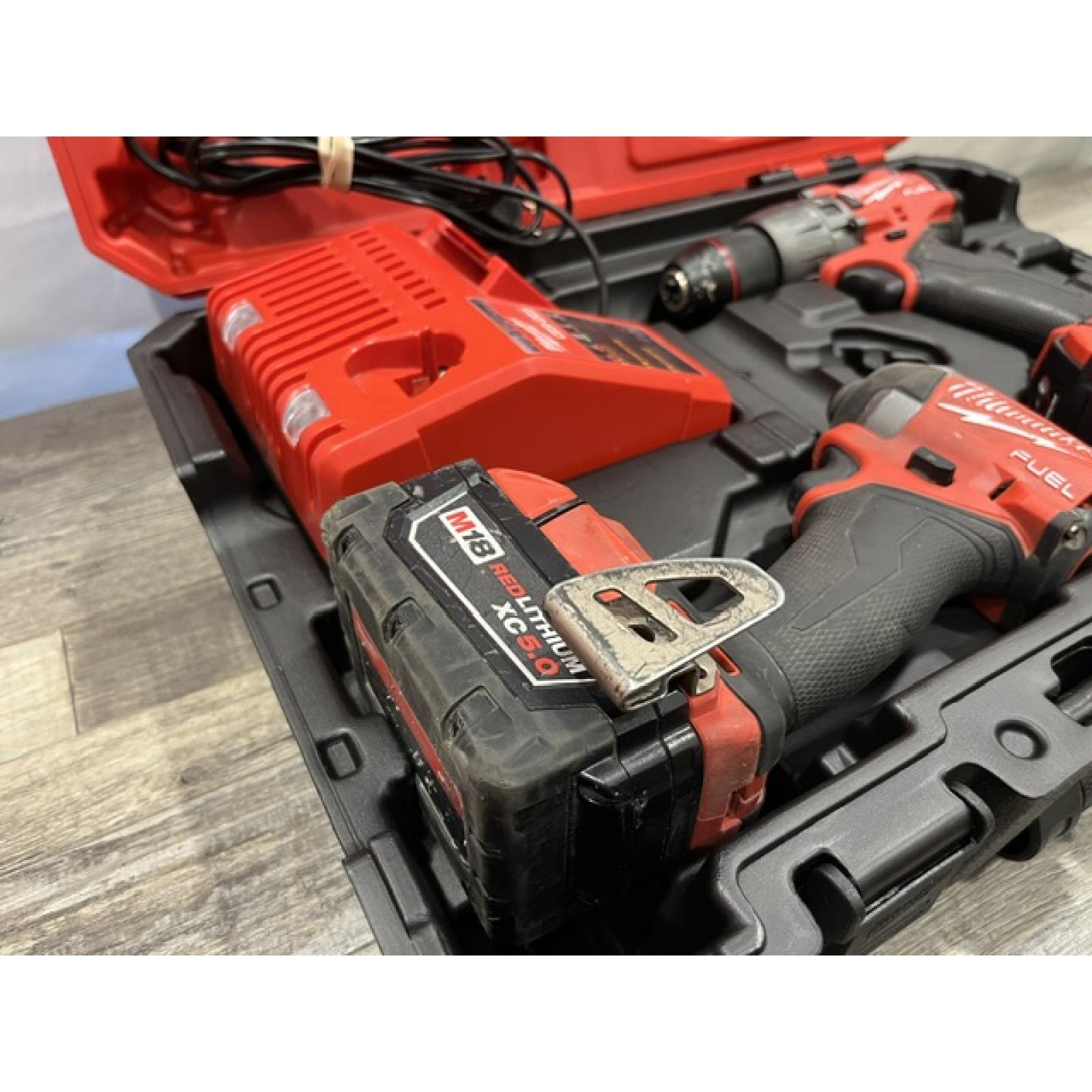 AS-IS Milwaukee FUEL 18V Lithium-Ion Brushless Cordless Hammer Drill and Impact Driver Combo Kit