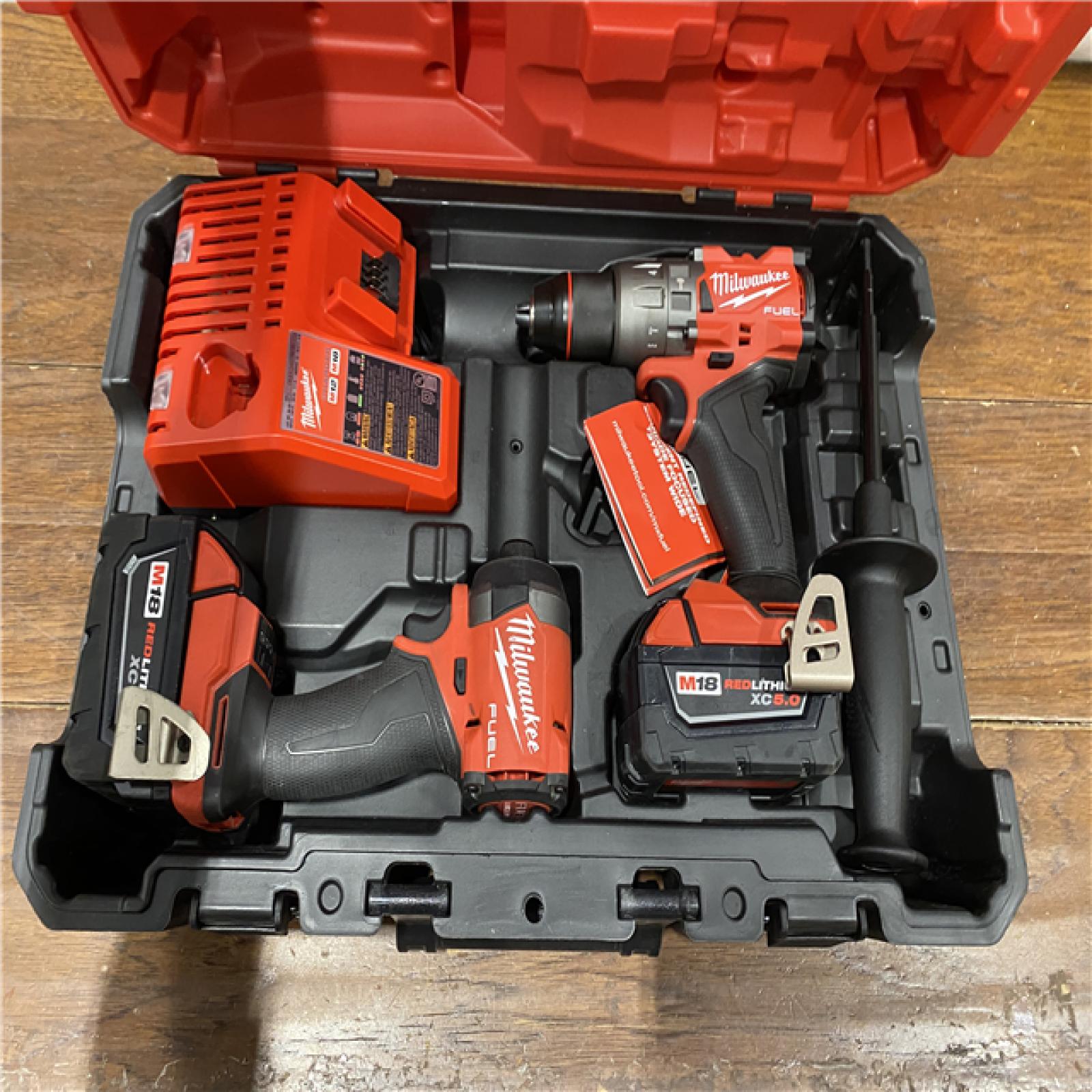 AS-IS MILWAUKEE M18 FUEL 18V Lithium-Ion Brushless Cordless Hammer Drill and Impact Driver Combo Kit (2-Tool) with 2 Batteries