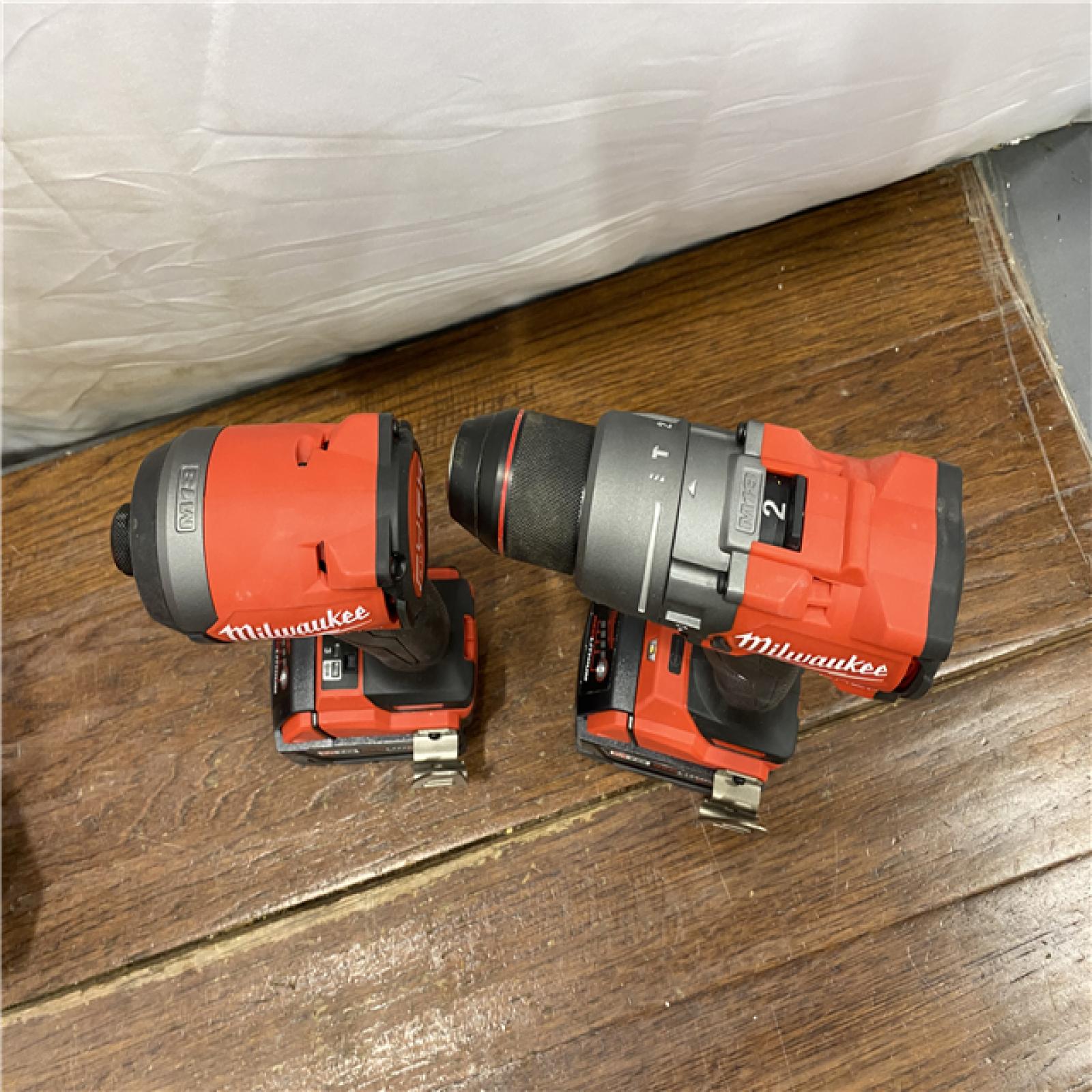 AS-IS MILWAUKEE M18 FUEL 18V Lithium-Ion Brushless Cordless Hammer Drill and Impact Driver Combo Kit (2-Tool) with 2 Batteries
