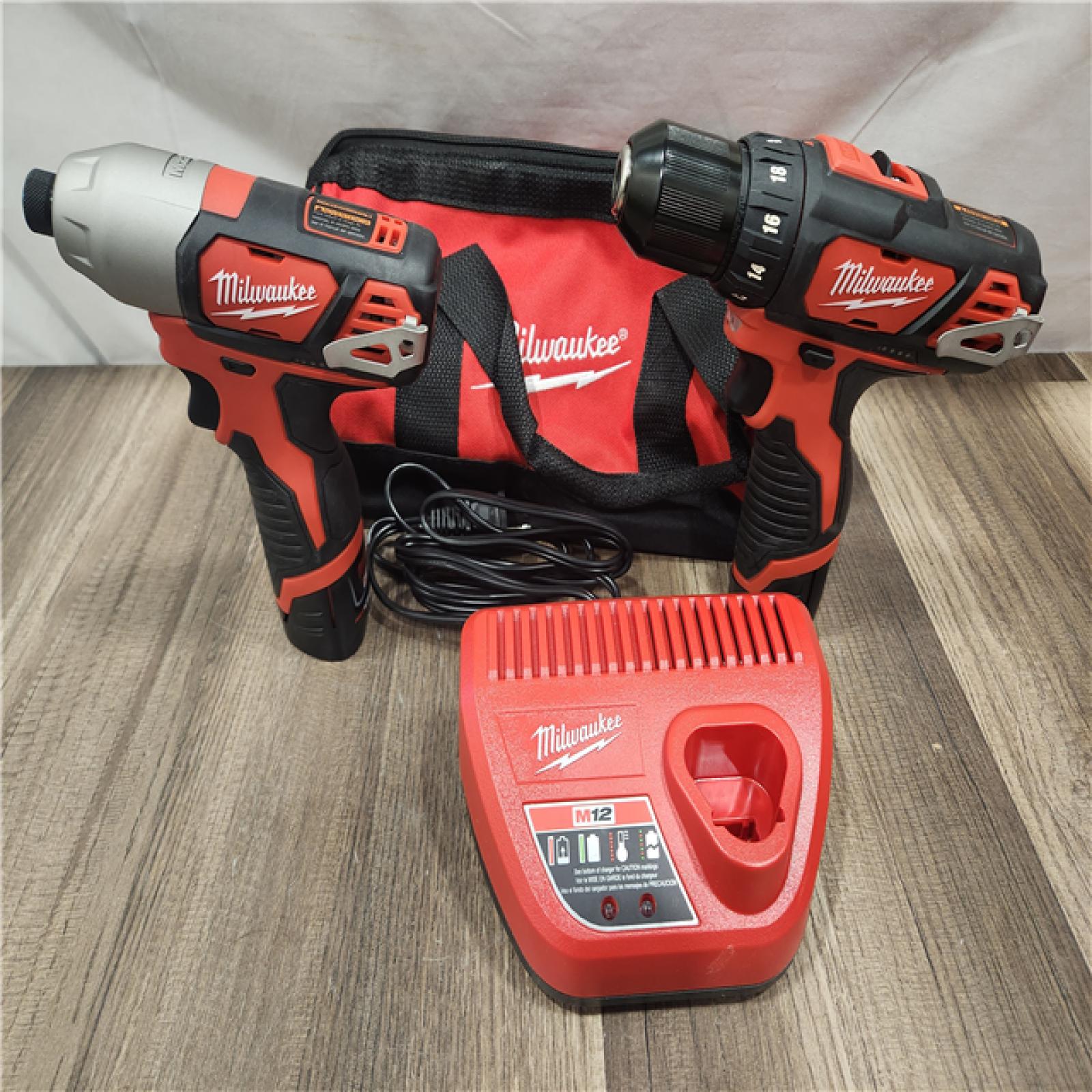 AS-IS- Milwaukee M12 Cordless Combination 3/8  Drill / Driver and 1/4  Hex Impact Driver Dual Power Tool Kit (2 Lithium Ion Batteries  Charger   and B