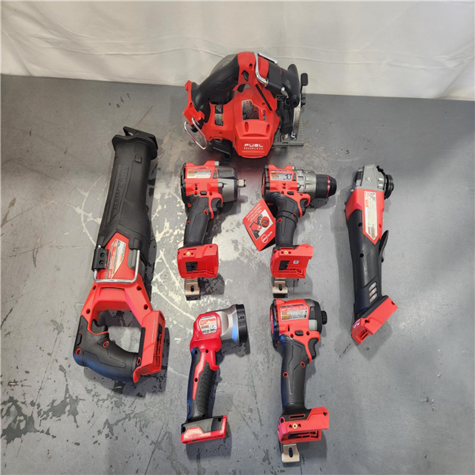 AS-IS- Milwaukee M18 FUEL 18V Lithium-Ion Brushless Cordless Combo Kit with Two 5.0 Ah Batteries  1 Charger  2 Tool Bags (7-Tool)