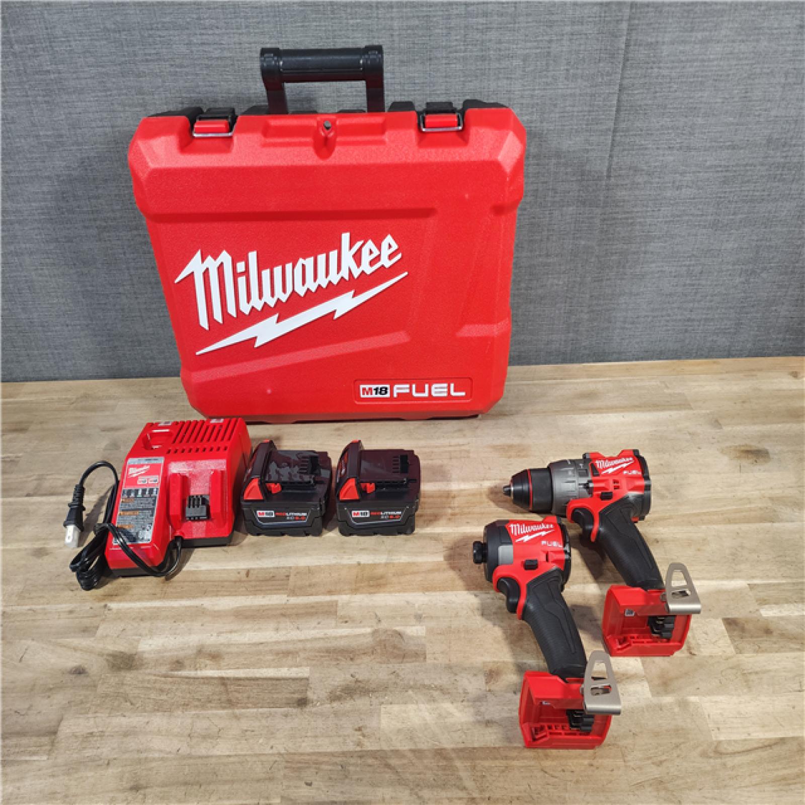 HOUSTON LOCATION - AS-IS (APPEARS LIKE NEW) MILWAUKEE FUEL 18V Lithium-Ion Brushless Cordless Hammer Drill and Impact Driver Combo Kit (2-Tool) with 2 Batteries