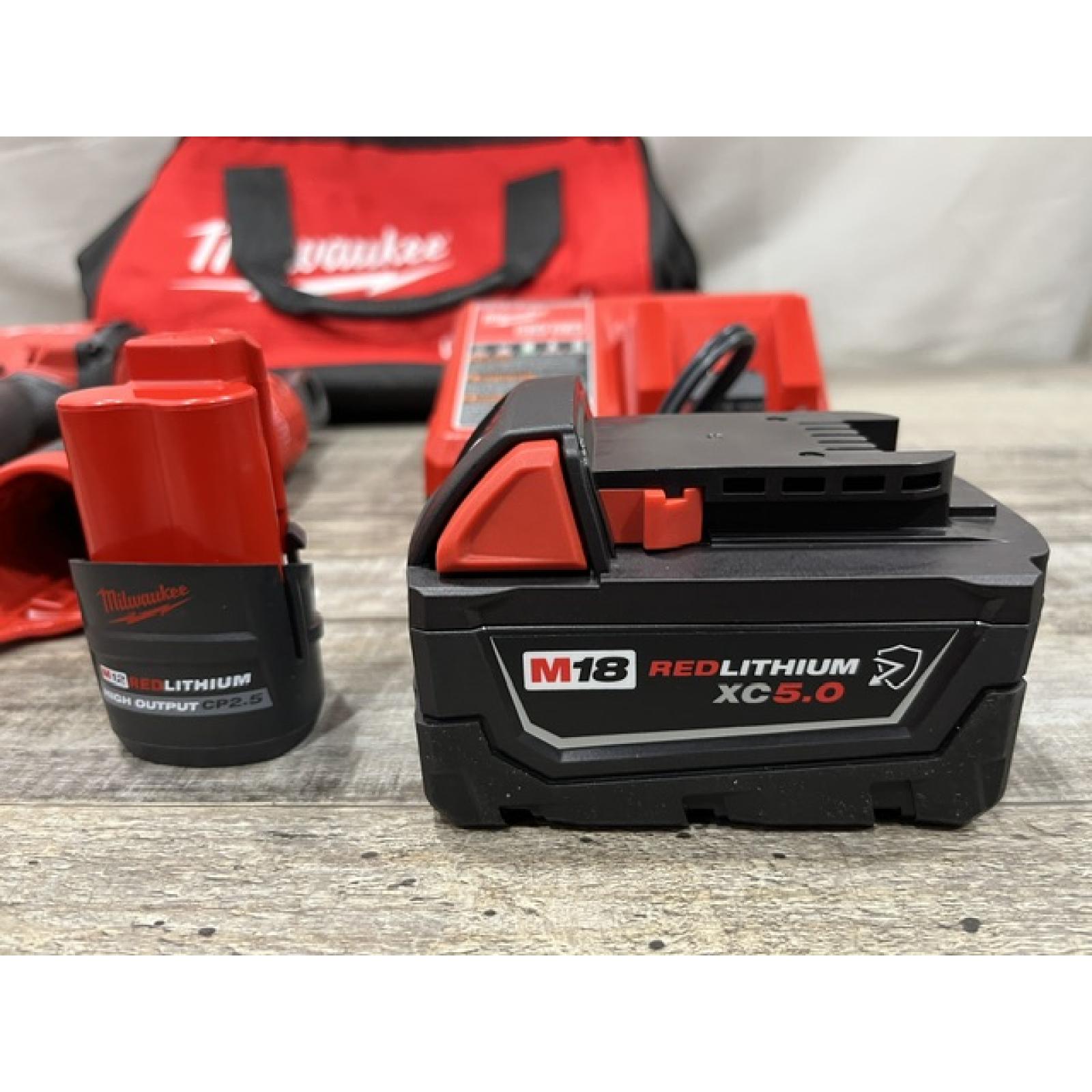 AS-IS Milwaukee FUEL 18V Cordless Mid Torque 1/2 in. Impact Wrench w/ 12 FUEL 3/8 in. Ratchet Combo Kit