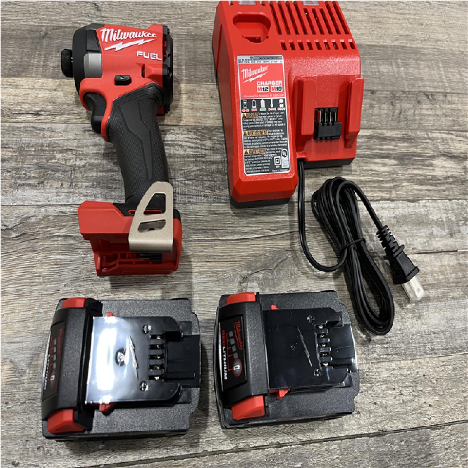 AS-IS Milwaukee FUEL 18V Lithium-Ion Brushless Cordless 1/4 in. Hex Impact Driver Kit