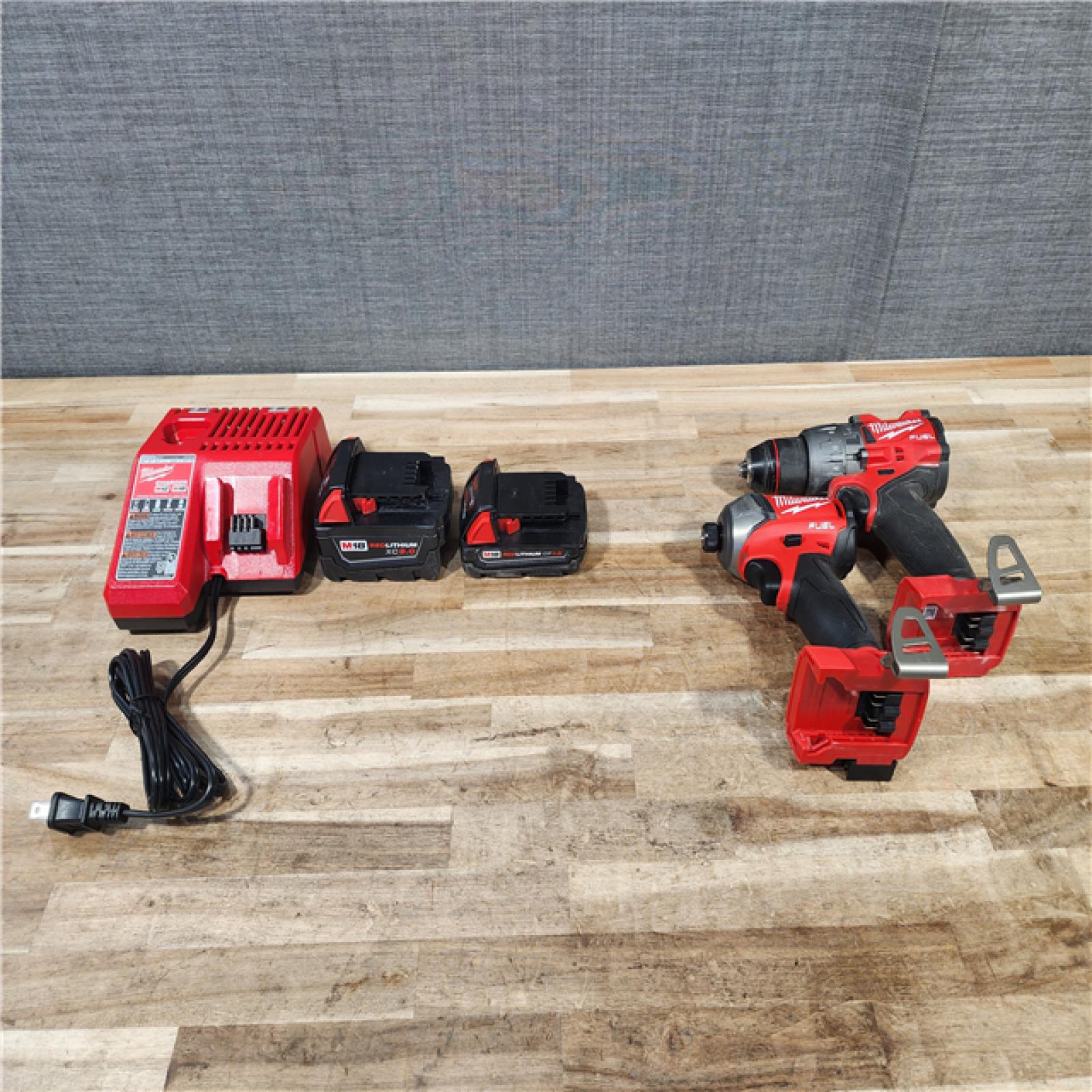 HOUSTON LOCATION - AS-IS MILWAUKEE 2 TOOL COMBO KIT W/ (2) BATTERY & CHARGER