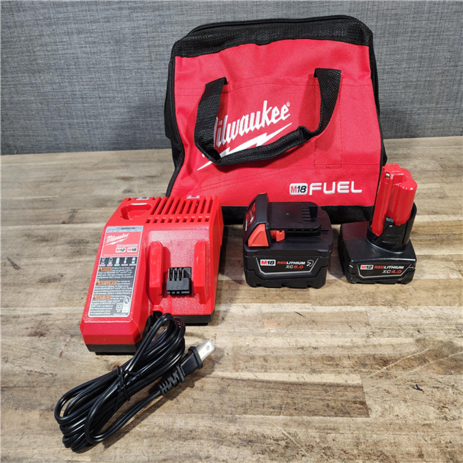 HOUSTON LOCATION - AS-IS MILWAUKEE 2 TOOL COMBO KIT W/ (2) BATTERY & CHARGER
