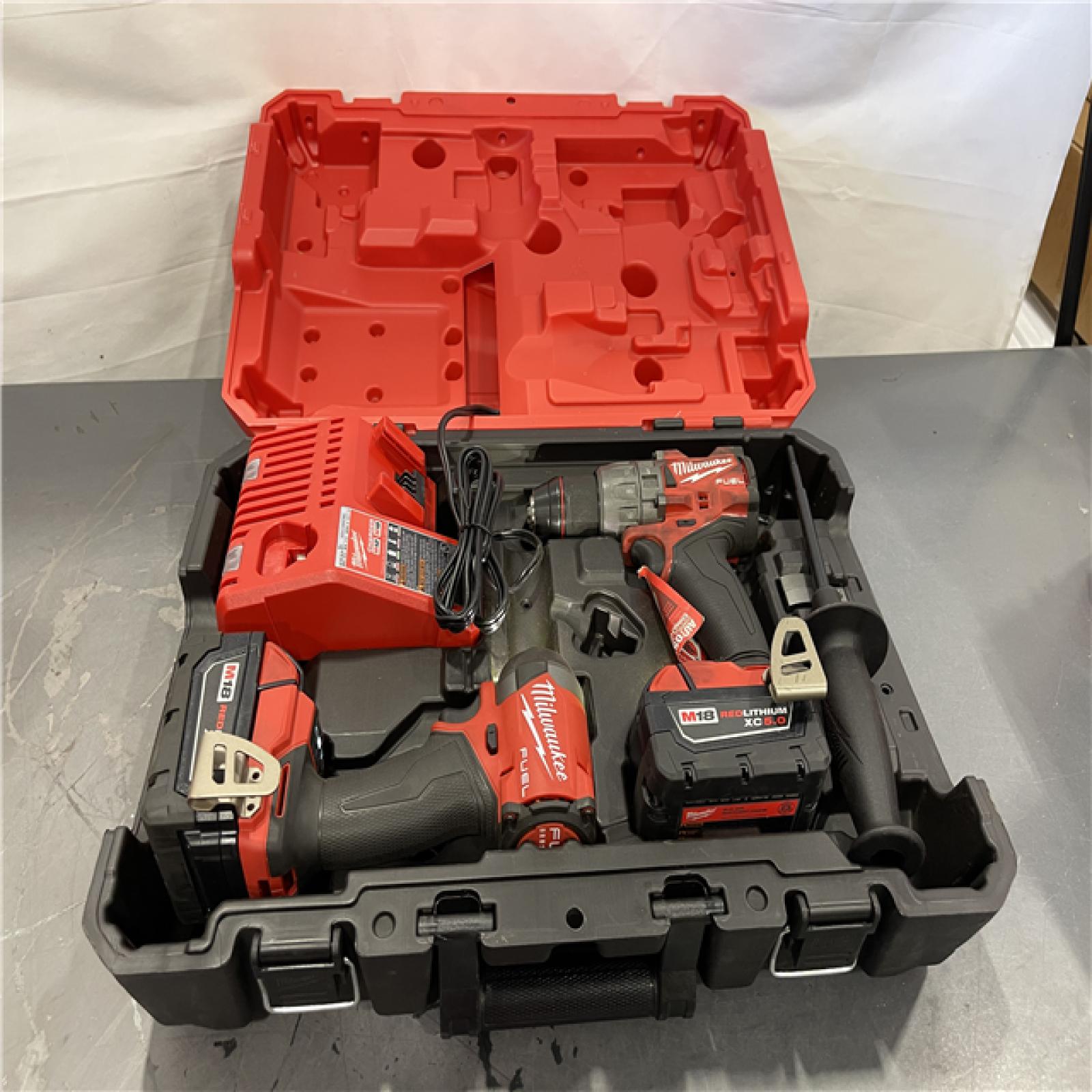 AS-IS - Milwaukee M18 FUEL 18V Lithium-Ion Brushless Cordless Hammer Drill and Impact Driver Combo Kit