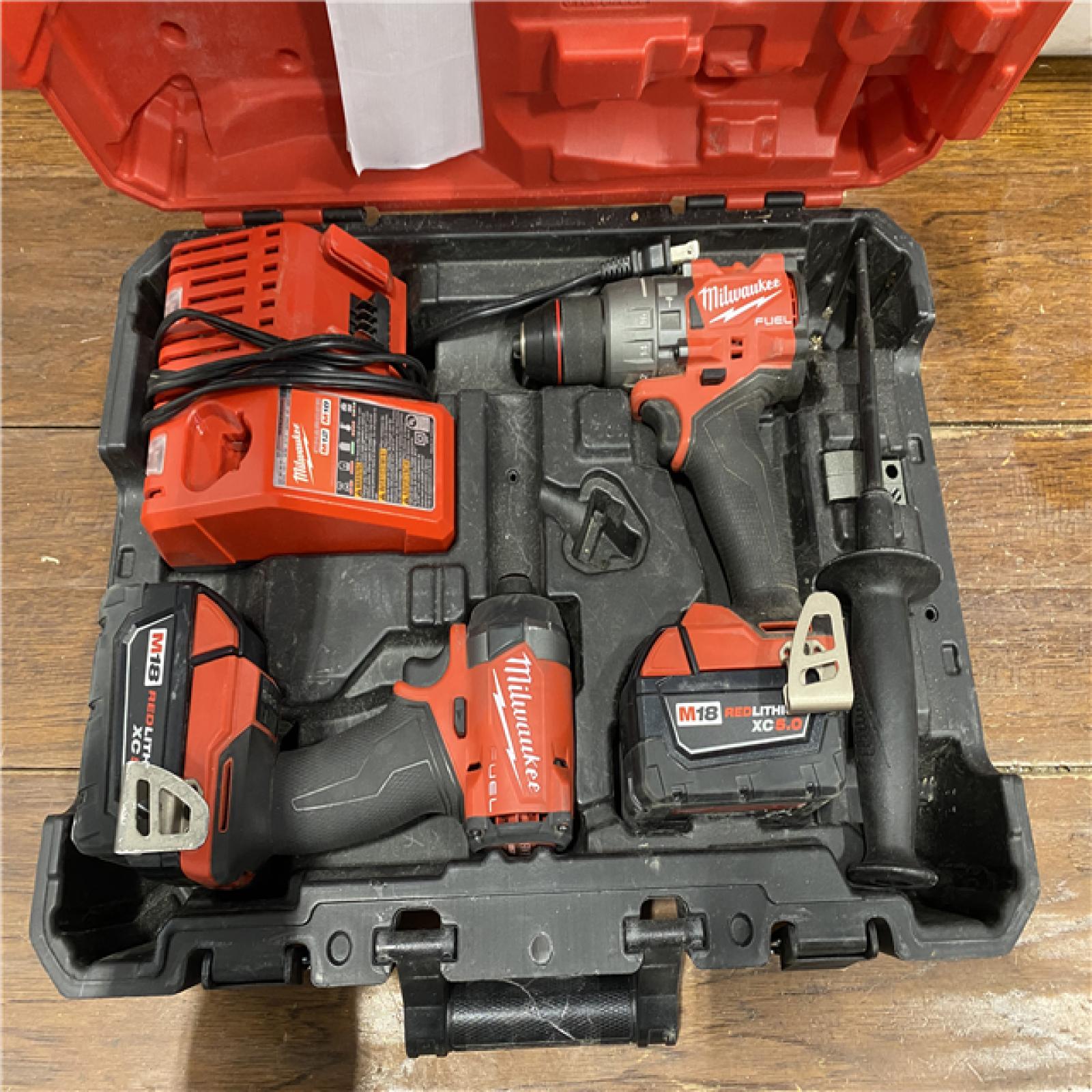 AS-IS MILWAUKEE M18 FUEL 18V Lithium-Ion Brushless Cordless Hammer Drill and Impact Driver Combo Kit (2-Tool) with 2 Batteries