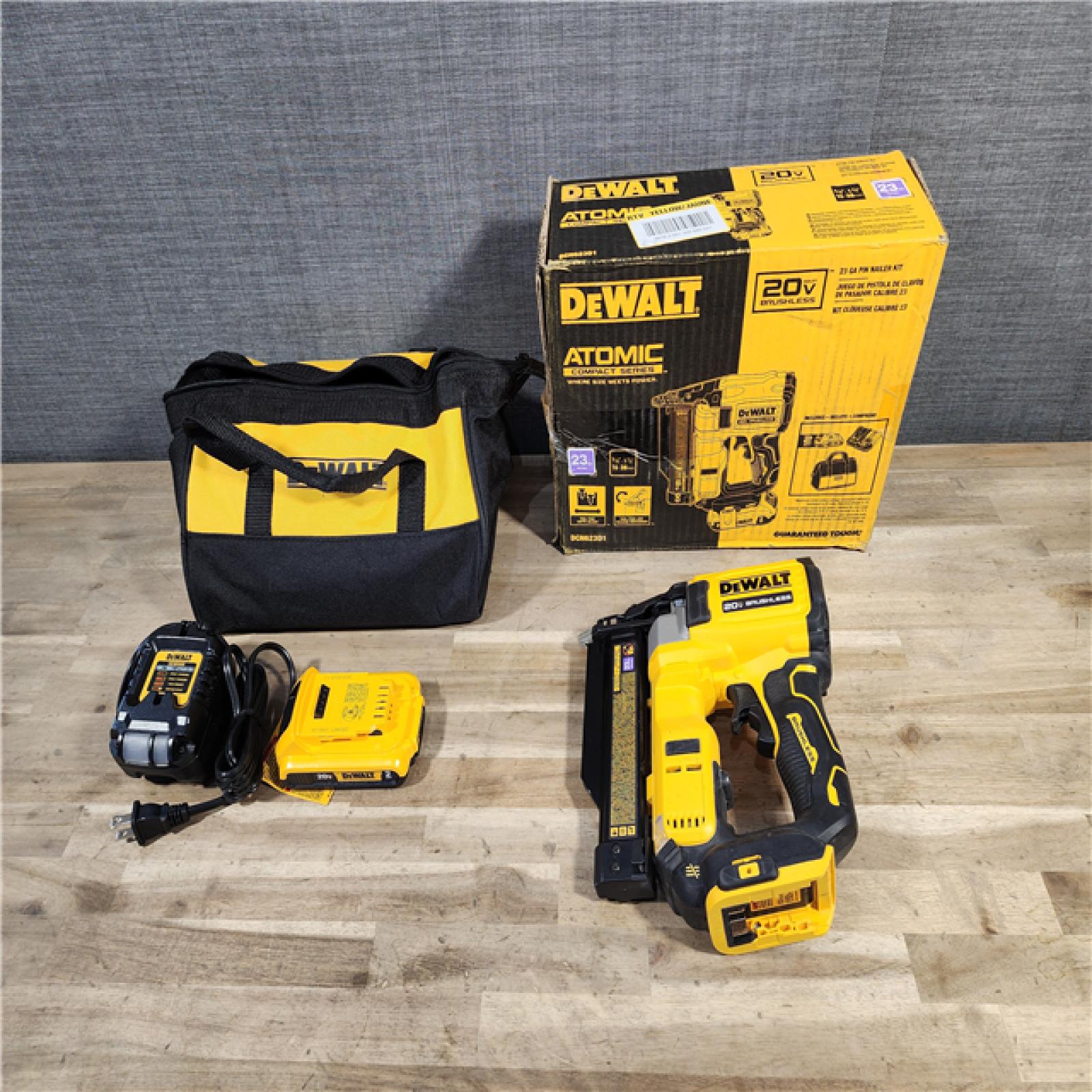 HOUSTON LOCATION - AS-IS DEWALT ATOMIC 20V MAX Lithium Ion Cordless 23 Gauge Pin Nailer Kit with 2.0Ah Battery and Charger