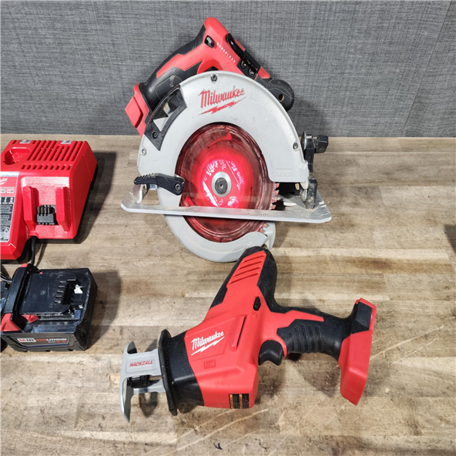 HOUSTON LOCATION - AS-IS Milwaukee M18 18-Volt Lithium-Ion Brushless Cordless Combo Kit (4-Tool) with 2-Batteries  1-Charger