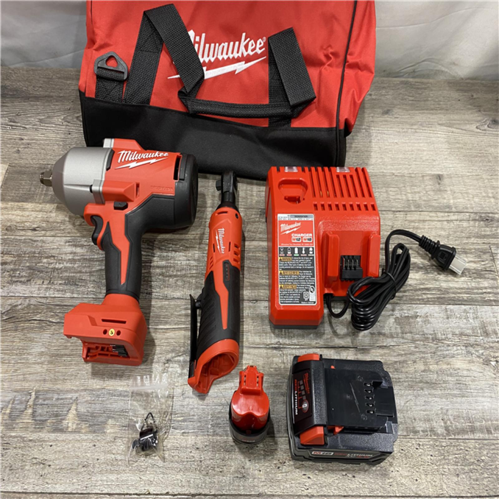 LIKE NEW - Milwaukee 12/18V Lithium-Ion Cordless 3/8 in. Ratchet and 1/2 in. High Torque Impact Wrench with Friction Ring Combo Kit