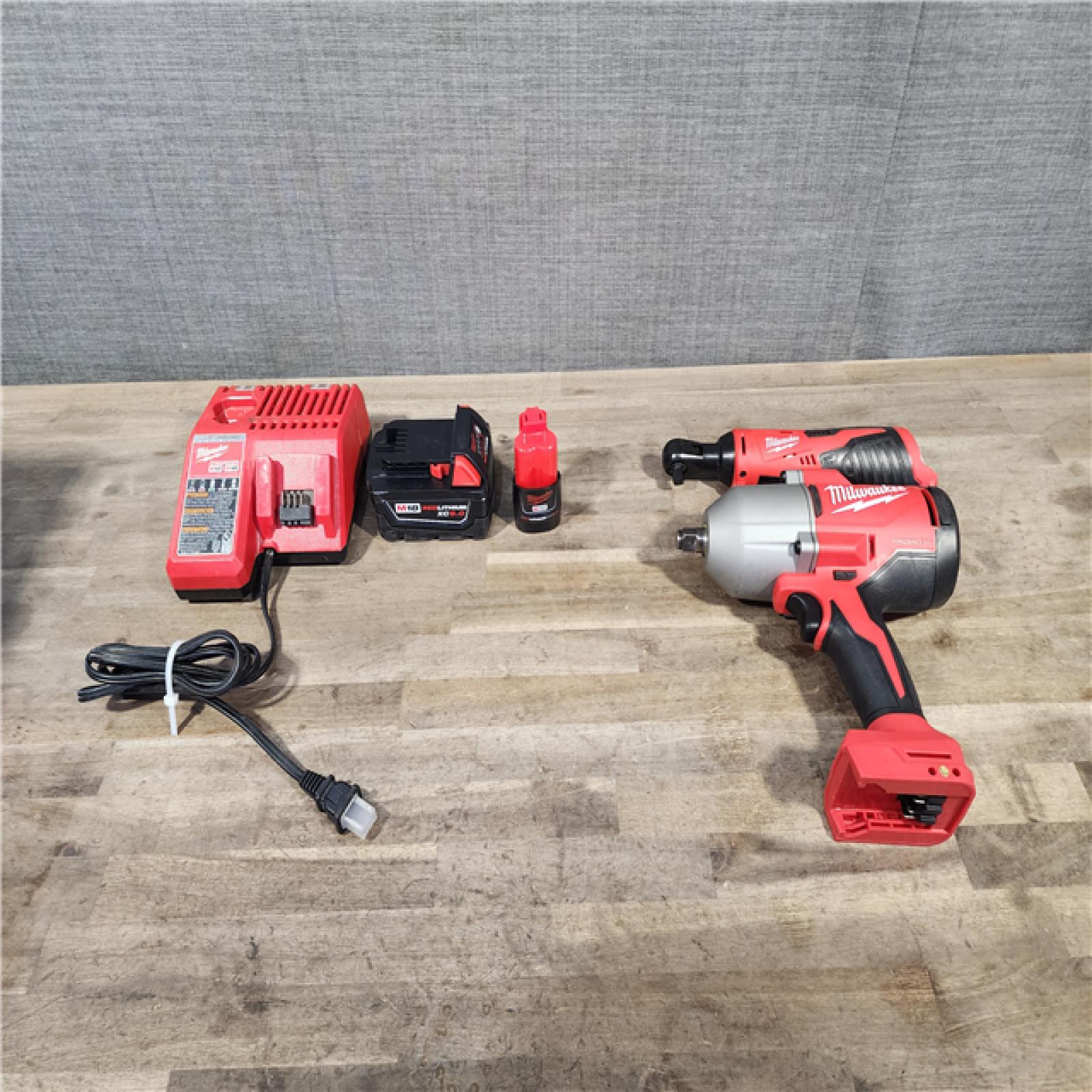 HOUSTON LOCATION - AS-IS Milwaukee M12/M18 12/18V Lithium-Ion Cordless 3/8 in. Ratchet and 1/2 in. High Torque Impact Wrench with Friction Ring Combo Kit