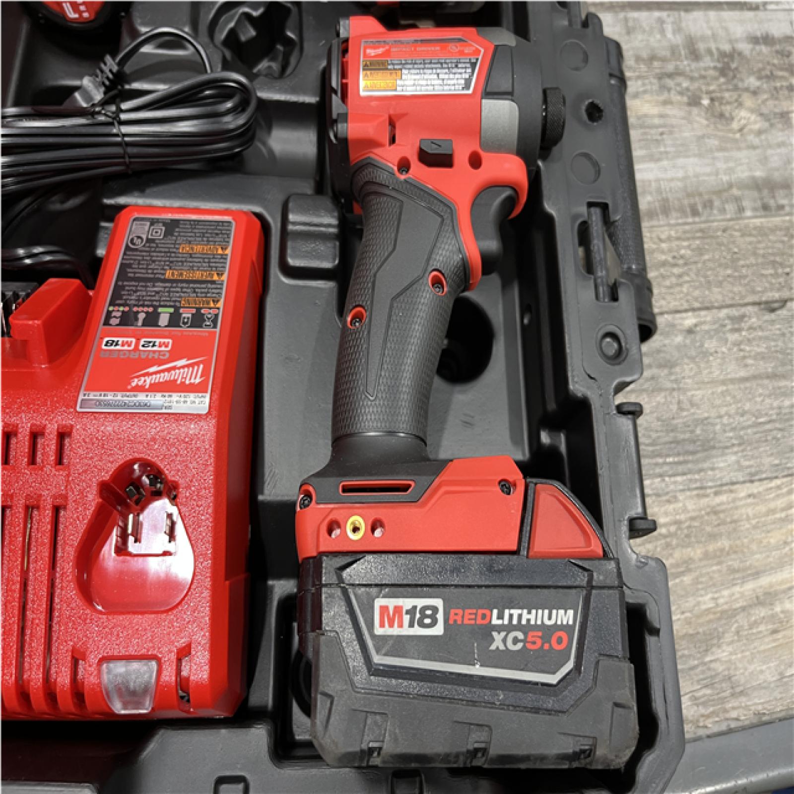 AS-IS Milwaukee FUEL 18V Lithium-Ion Brushless Cordless Hammer Drill and Impact Driver Combo Kit