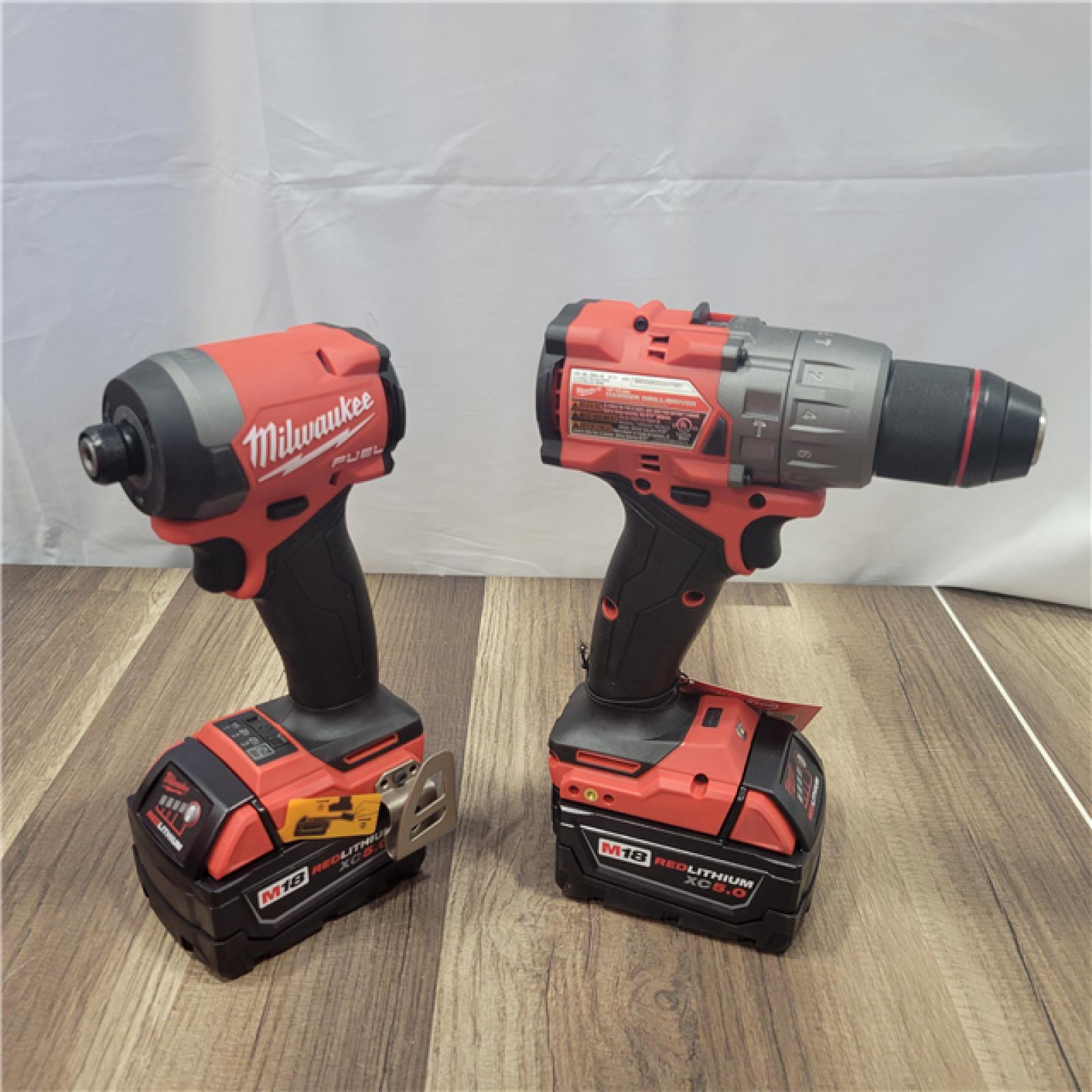 AS-IS   Milwaukee M18 FUEL 18V Lithium-Ion Brushless Cordless Hammer Drill and Impact Driver Combo Kit (2-Tool) with 2 Batteries