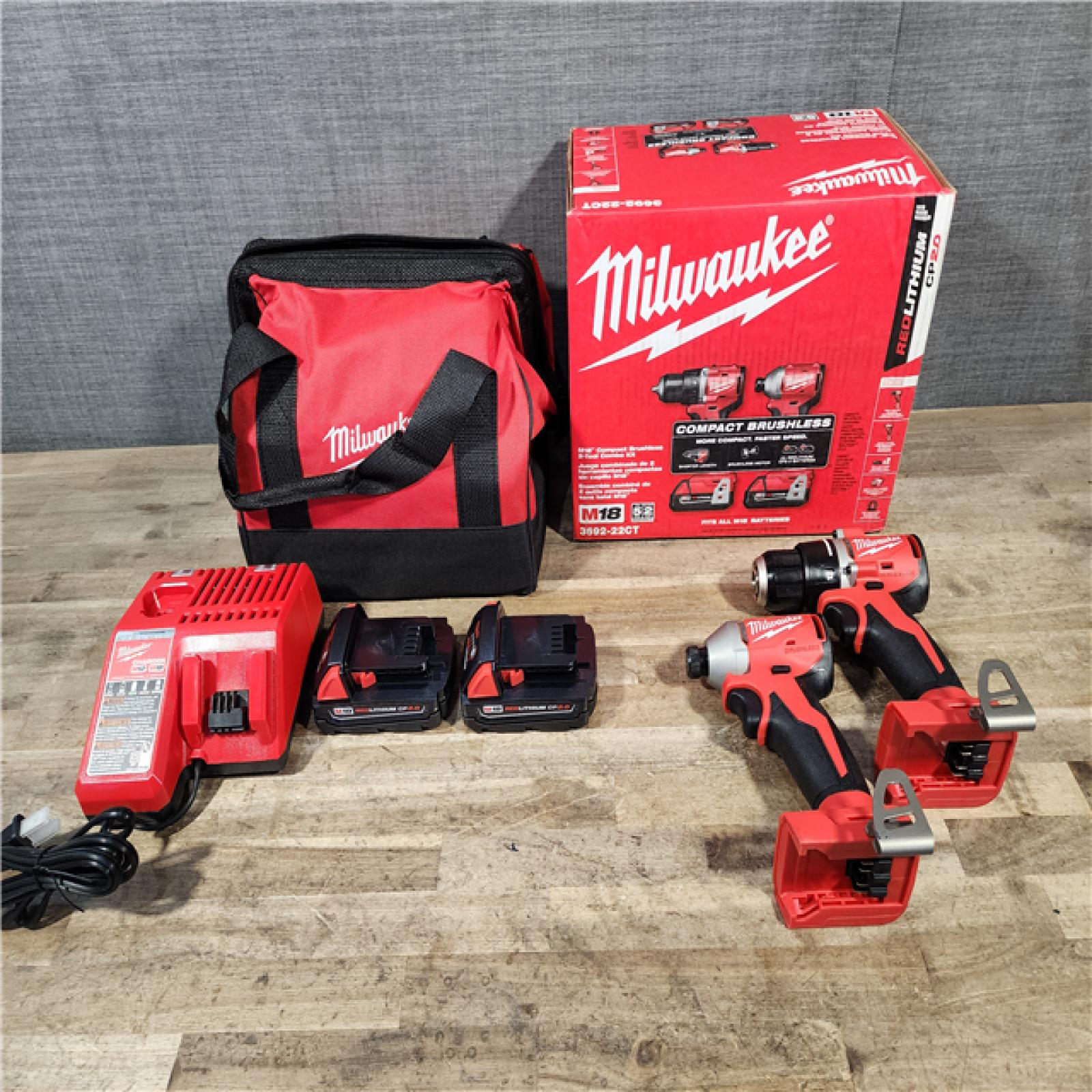 HOUSTON LOCATION - AS-IS Milwaukee M18 18V Lithium-Ion Brushless Cordless Compact Drill/Impact Combo Kit (2-Tool) W/(2) 2.0 Ah Batteries  Charger & Bag