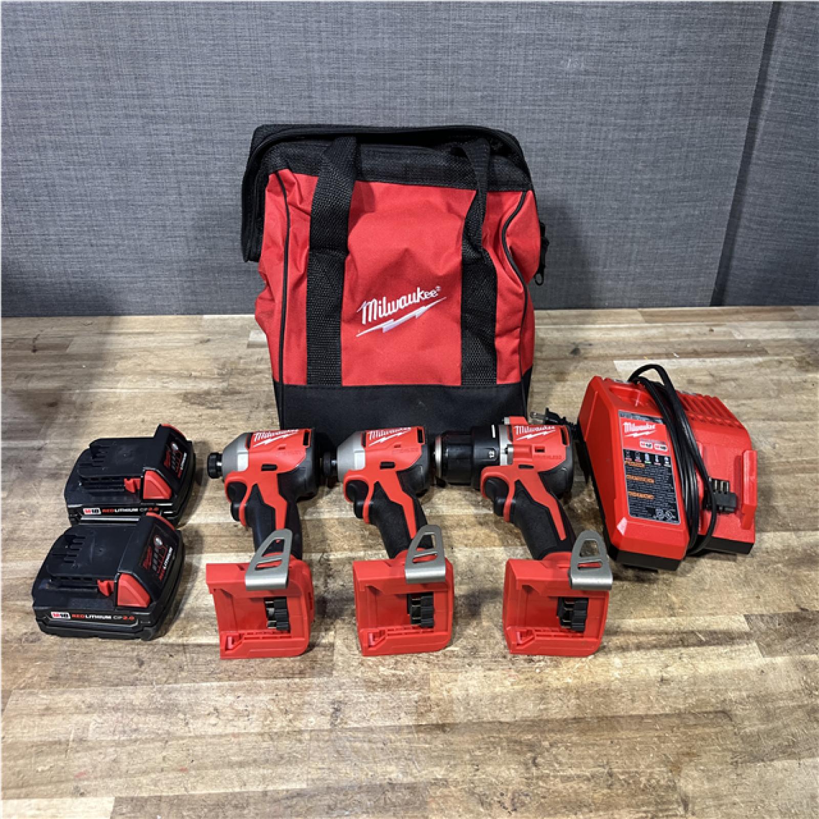Houston Location AS-IS Milwaukee Drill Driver and Impact Drivers QTY/2 and Batteries QTY/2 with Charger