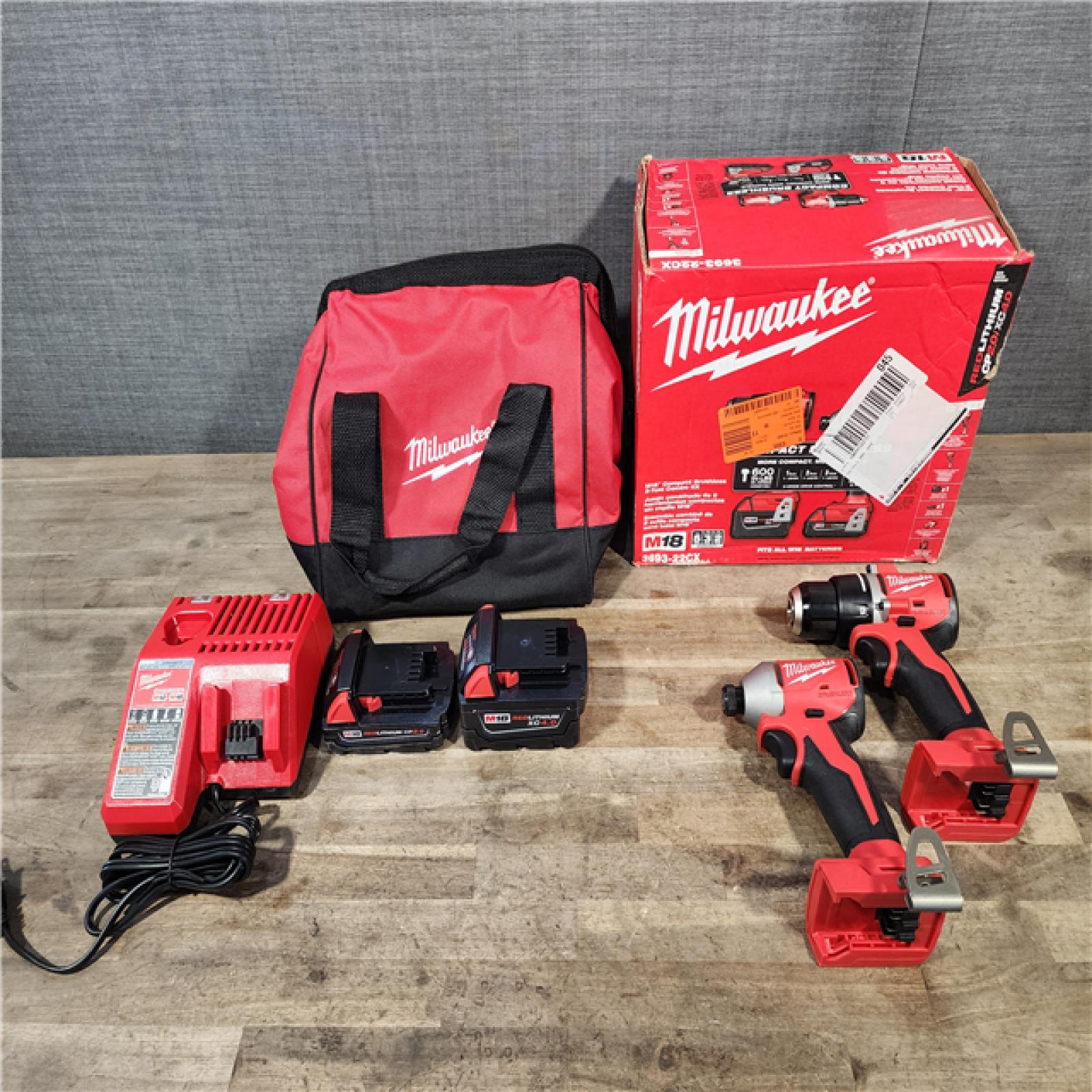 HOUSTON LOCATION - AS-IS M18 18-Volt Lithium-Ion Brushless Cordless Compact Hammer Drill/Impact Combo Kit (2-Tool) with (2) Batteries  Bag