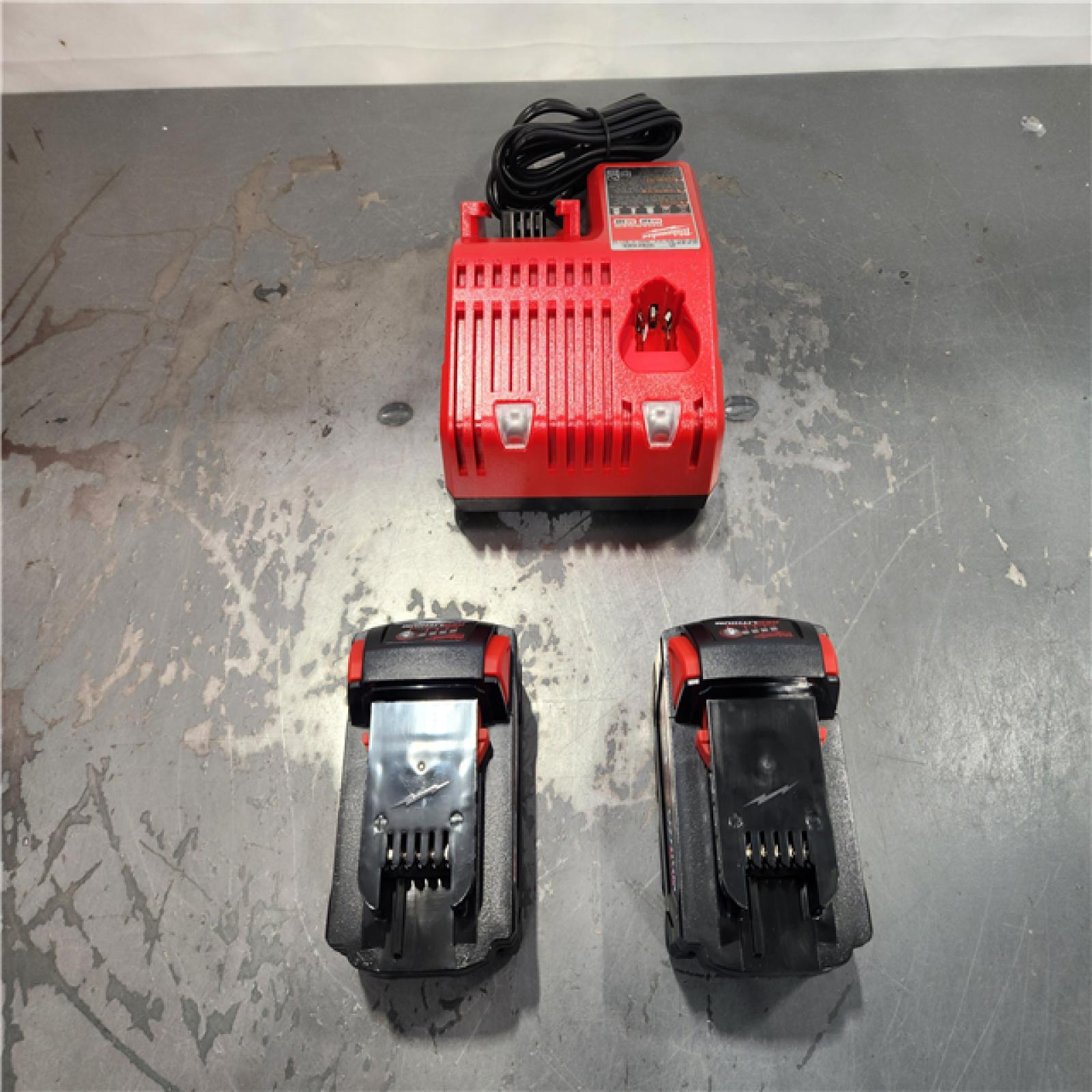 AS-IS- Milwaukee M18 18-Volt Lithium-Ion XC Starter Kit with Two 5.0Ah Batteries and Charger