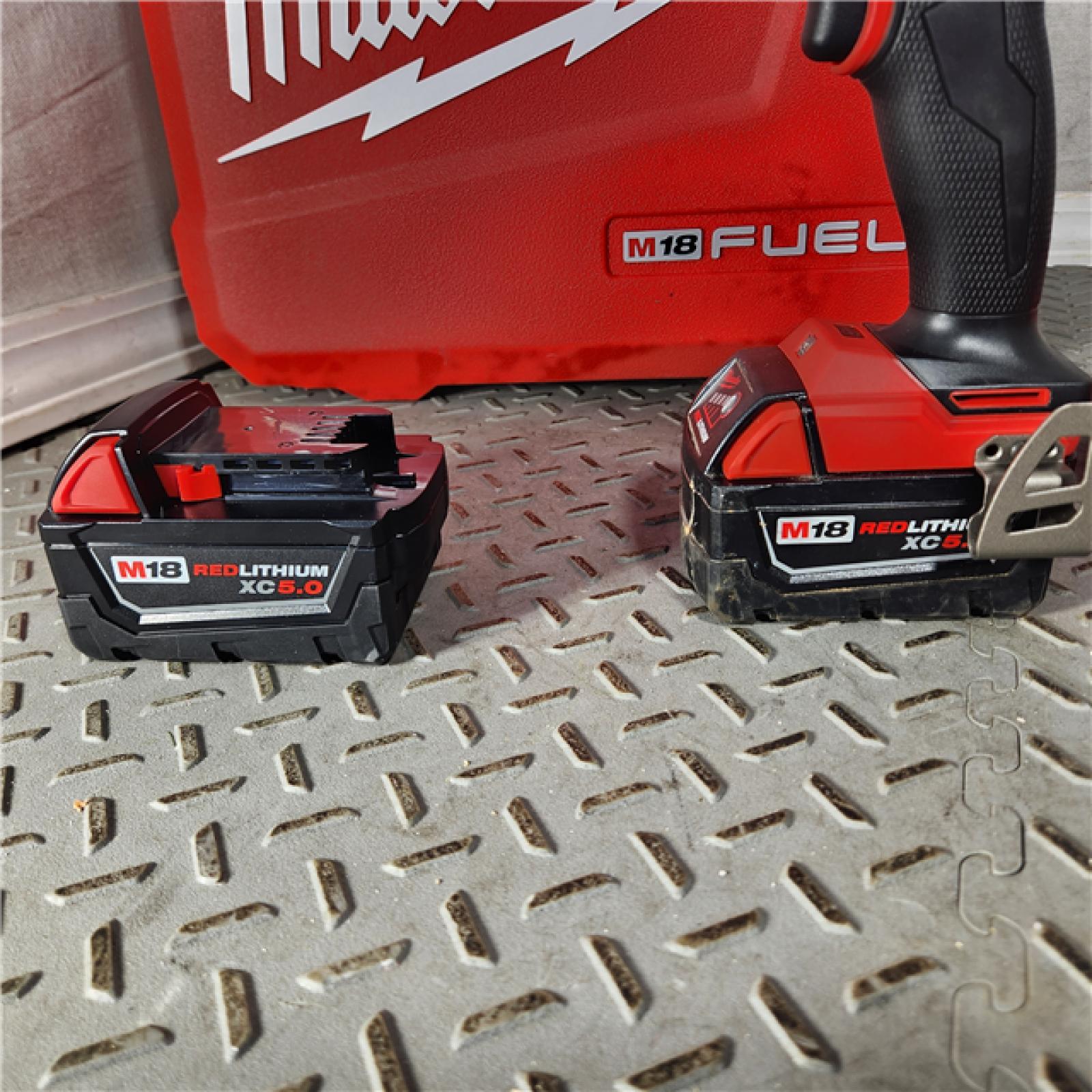 Houston Location - As-Is Milwaukee 2904-22 Hammer Drill Driver Kit with Batteries  Charger & Tool Case  Red - Appears IN GOOD Condition