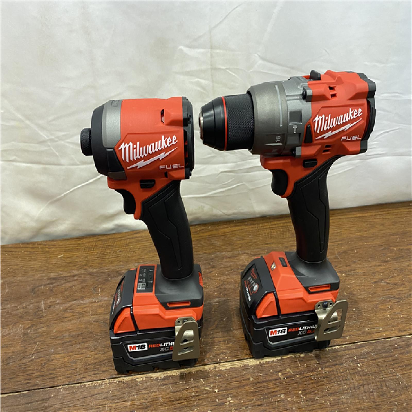 AS-IS MILWAUKEE M18 FUEL 18V Lithium-Ion Brushless Cordless Hammer Drill and Impact Driver Combo Kit (2-Tool) with 2 Batteries