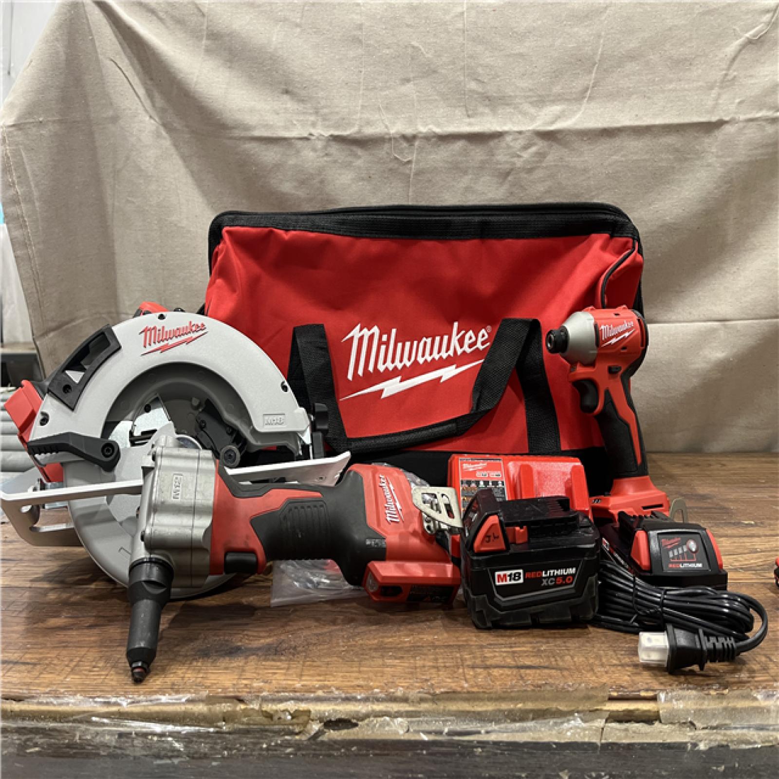 AS-IS Milwaukee M18 18-Volt Lithium-Ion Brushless Cordless Combo Kit (3-Tool) with 2-Batteries, 1-Charger and Tool Bag