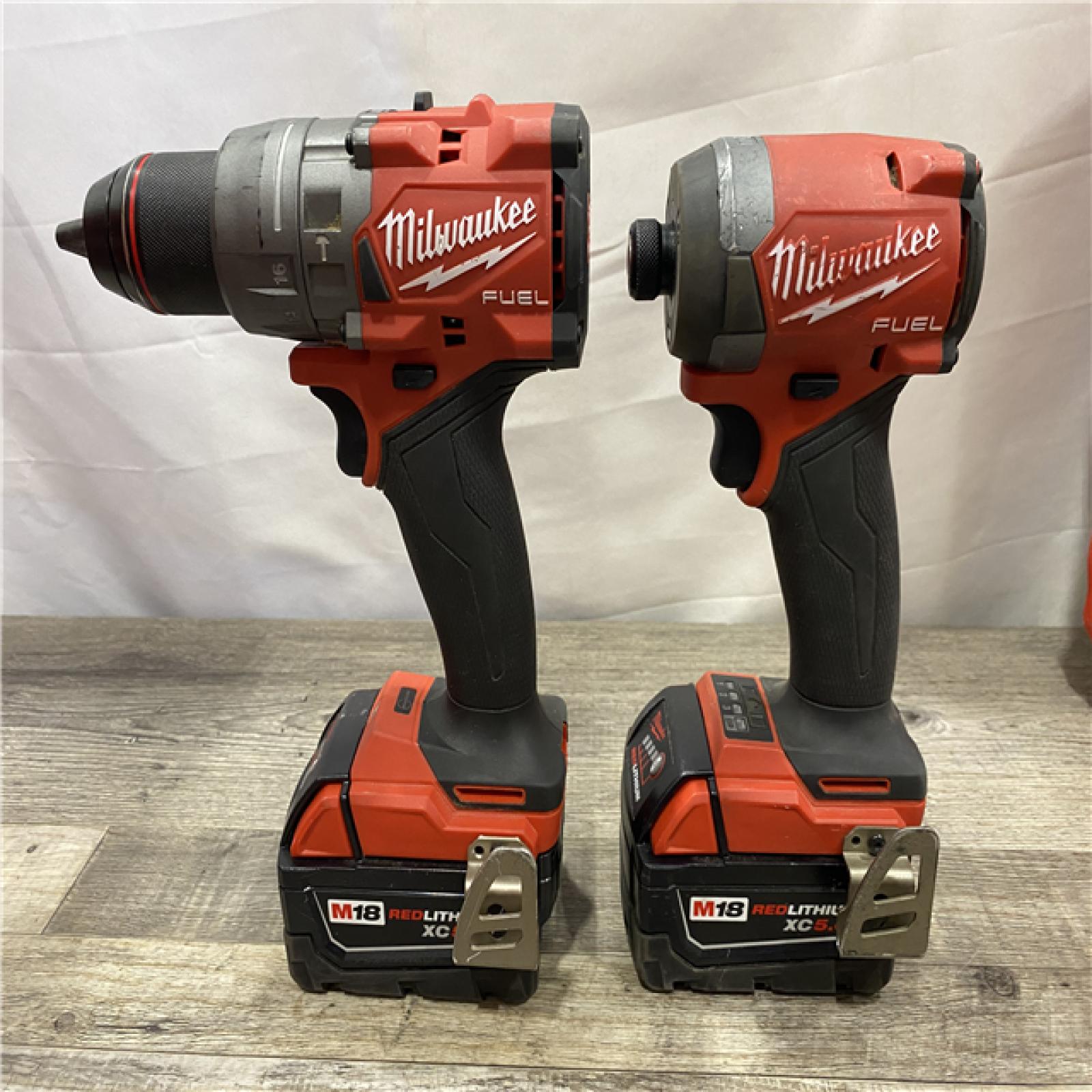 AS-IS Milwaukee FUEL 18V Lithium-Ion Brushless Cordless Hammer Drill and Impact Driver Combo Kit
