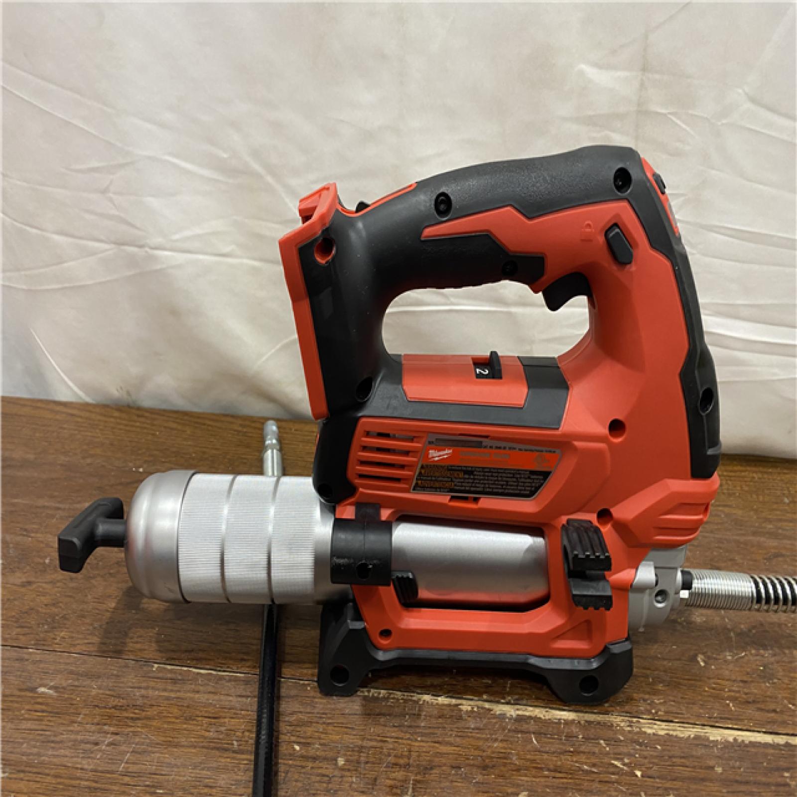 AS-IS Milwaukee Tool 10,000 PSI 14 Oz Battery-Operated Grease Gun - 48 Flexible Hose, 31 Strokes/oz | Part #2646-20