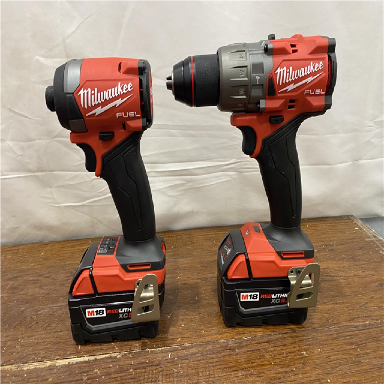 AS-IS MILWAUKEE M18 FUEL 18V Lithium-Ion Brushless Cordless Hammer Drill and Impact Driver Combo Kit (2-Tool) with 2 Batteries
