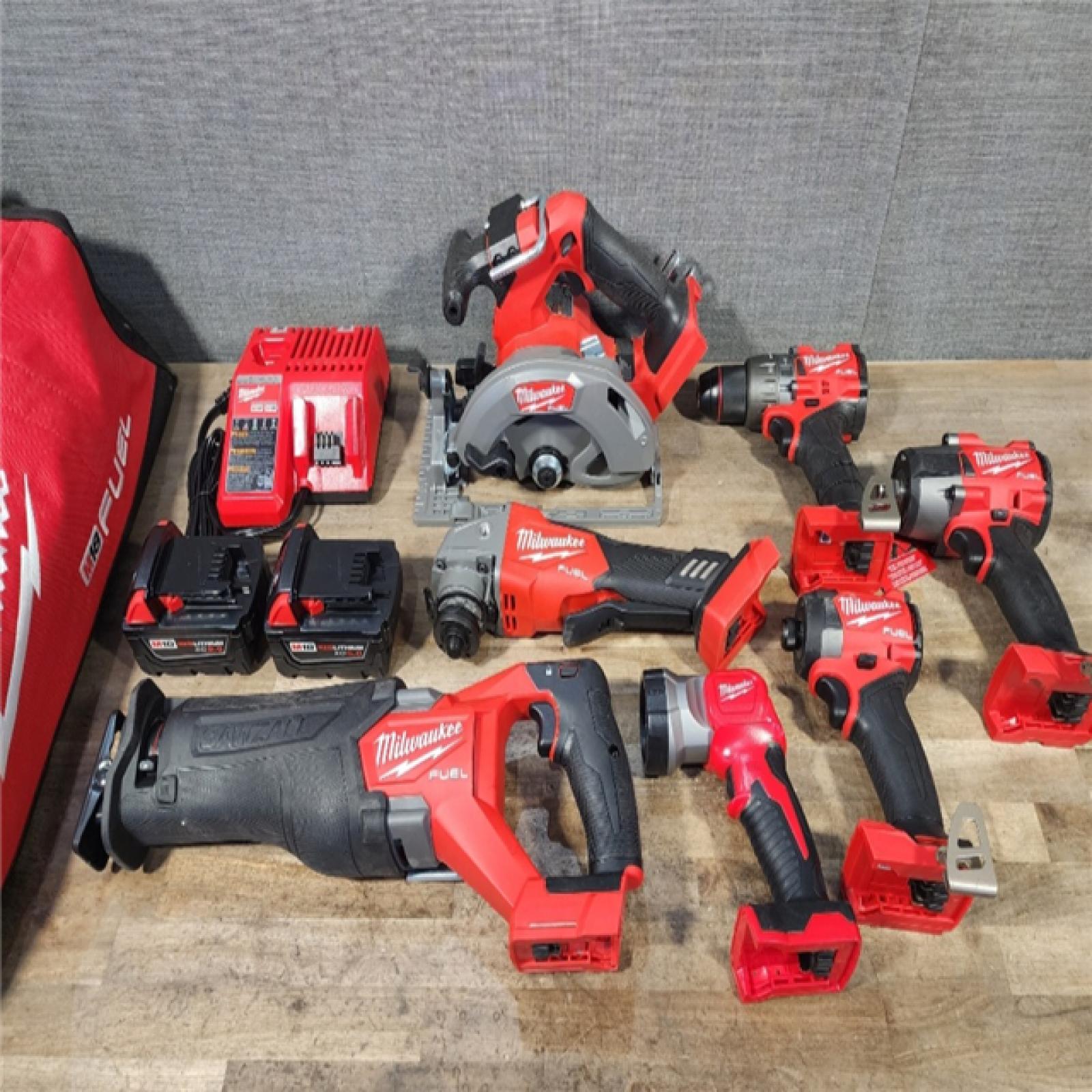 HOUSTON LOCATION - AS-IS Milwaukee M18 FUEL 18V Lithium-Ion Brushless Cordless Combo Kit with Two 5.0 Ah Batteries  1 Charger  2 Tool Bags (7-Tool)