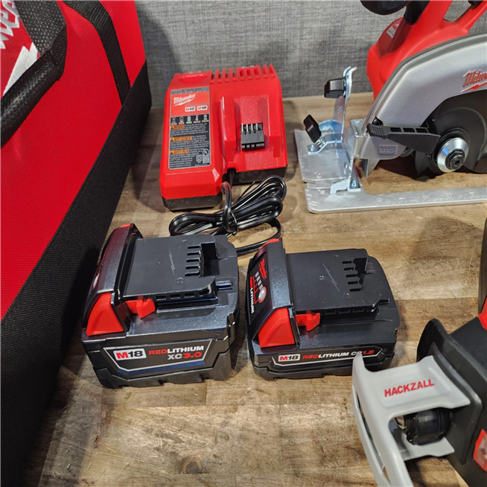 HOUSTON LOCATION - AS-IS (APPEARS LIKE NEW) Milwaukee M18 18-Volt Lithium-Ion Cordless Combo Tool Kit (5-Tool) with (1) 3.0Ah and (1) 1.5Ah Battery  (1) Charger  (1) Tool Bag