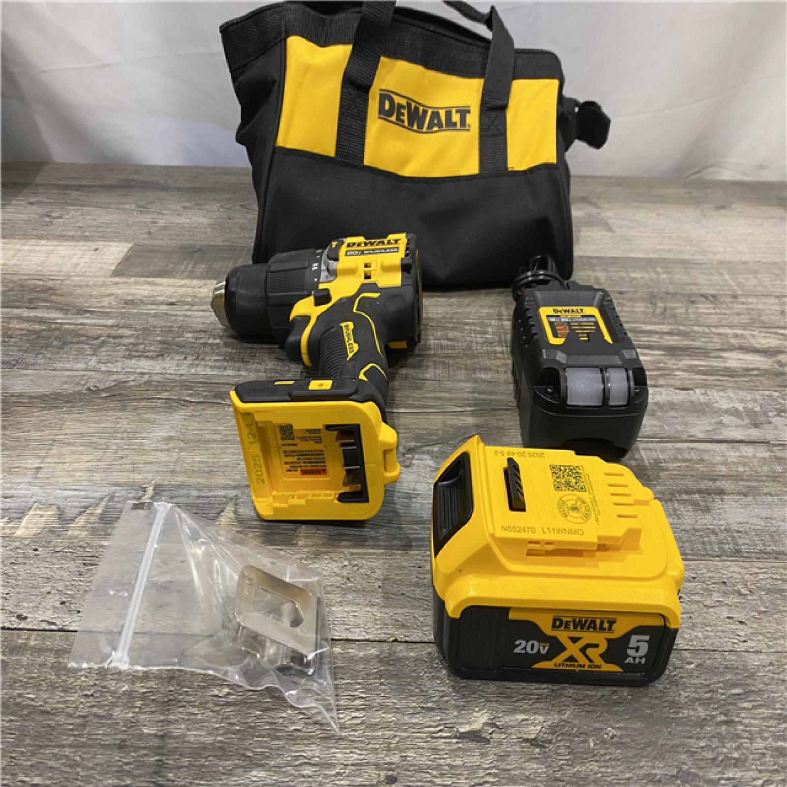 AS-IS DEWALT ATOMIC 20V Lithium-Ion Cordless 1/2 in. Hammer Drill Kit with 5.0 Ah Battery and Charger