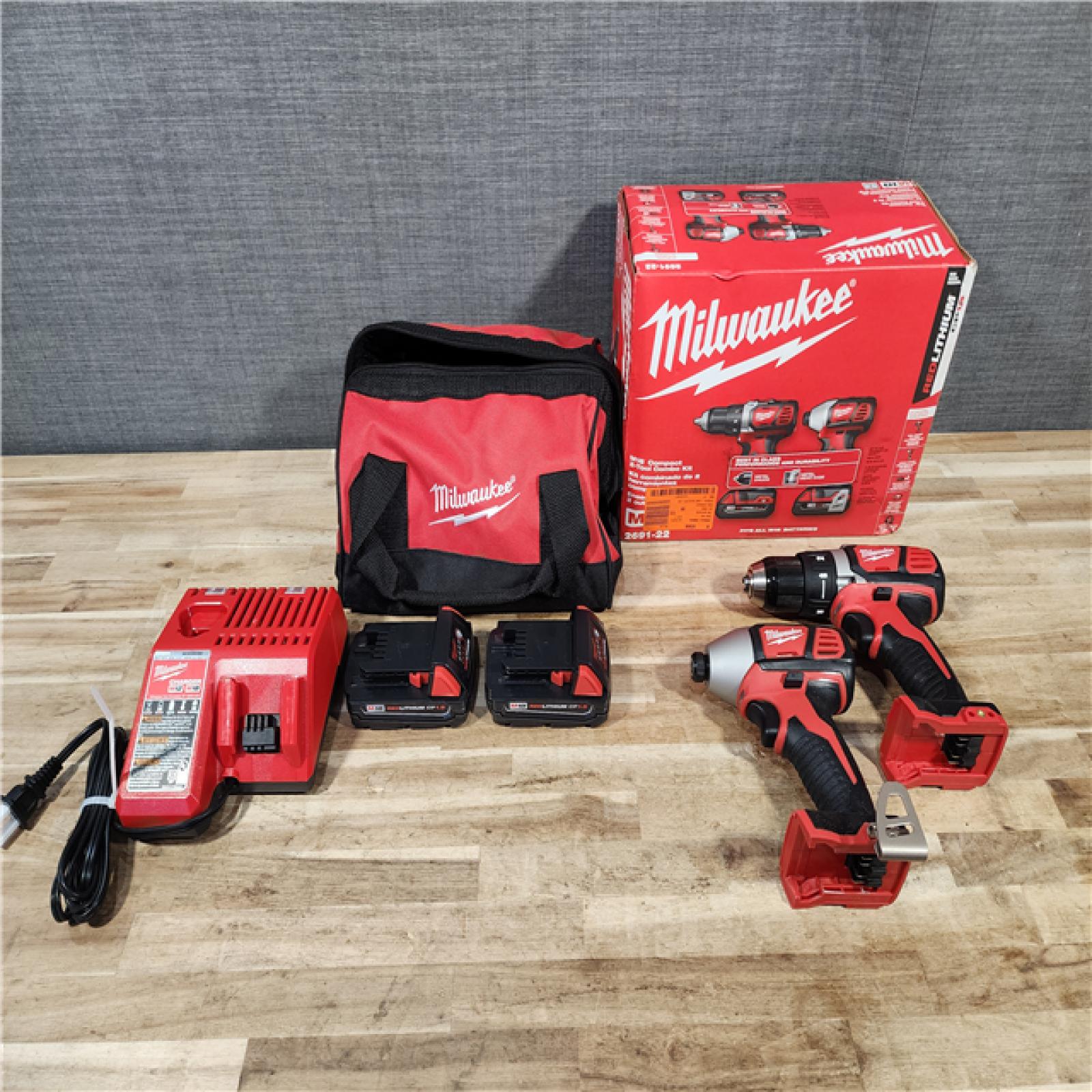 HOUSTON LOCATION - AS-IS Milwaukee 18V Lithium-Ion Cordless Drill Driver/Impact Driver Combo Kit