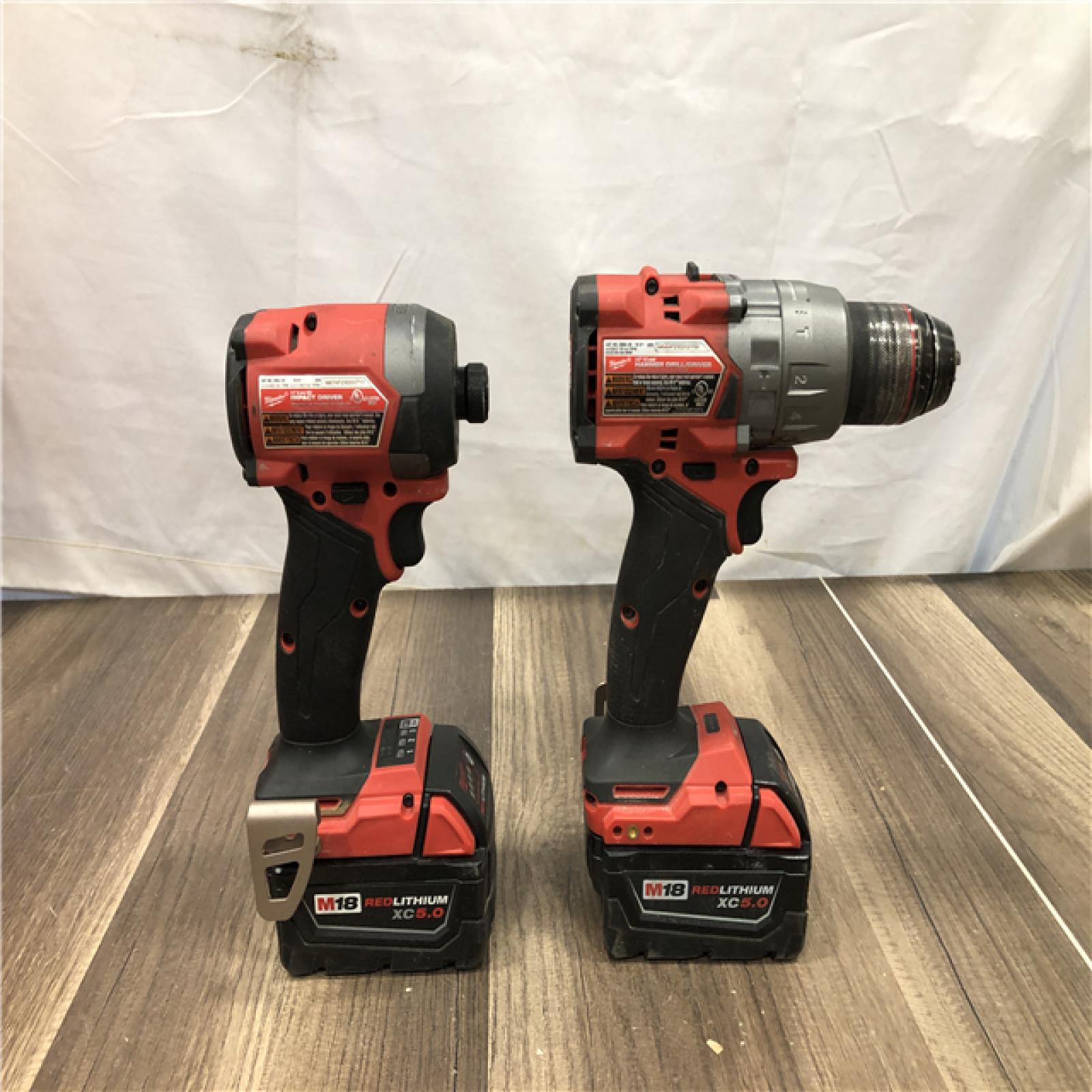 AS-IS Milwaukee FUEL 18V Lithium-Ion Brushless Cordless Hammer Drill and Impact Driver Combo Kit