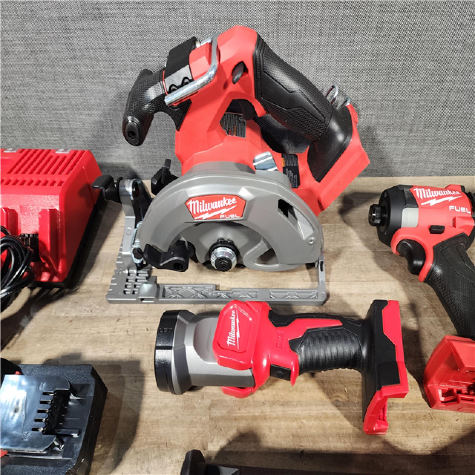 HOUSTON LOCATION - AS-IS (APPEARS LIKE NEW) M18 FUEL 18V Lithium-Ion Brushless Cordless 5-Tool Combo Kit with Two 5.0 Ah Batteries  1 Charger 1 Tool Bag