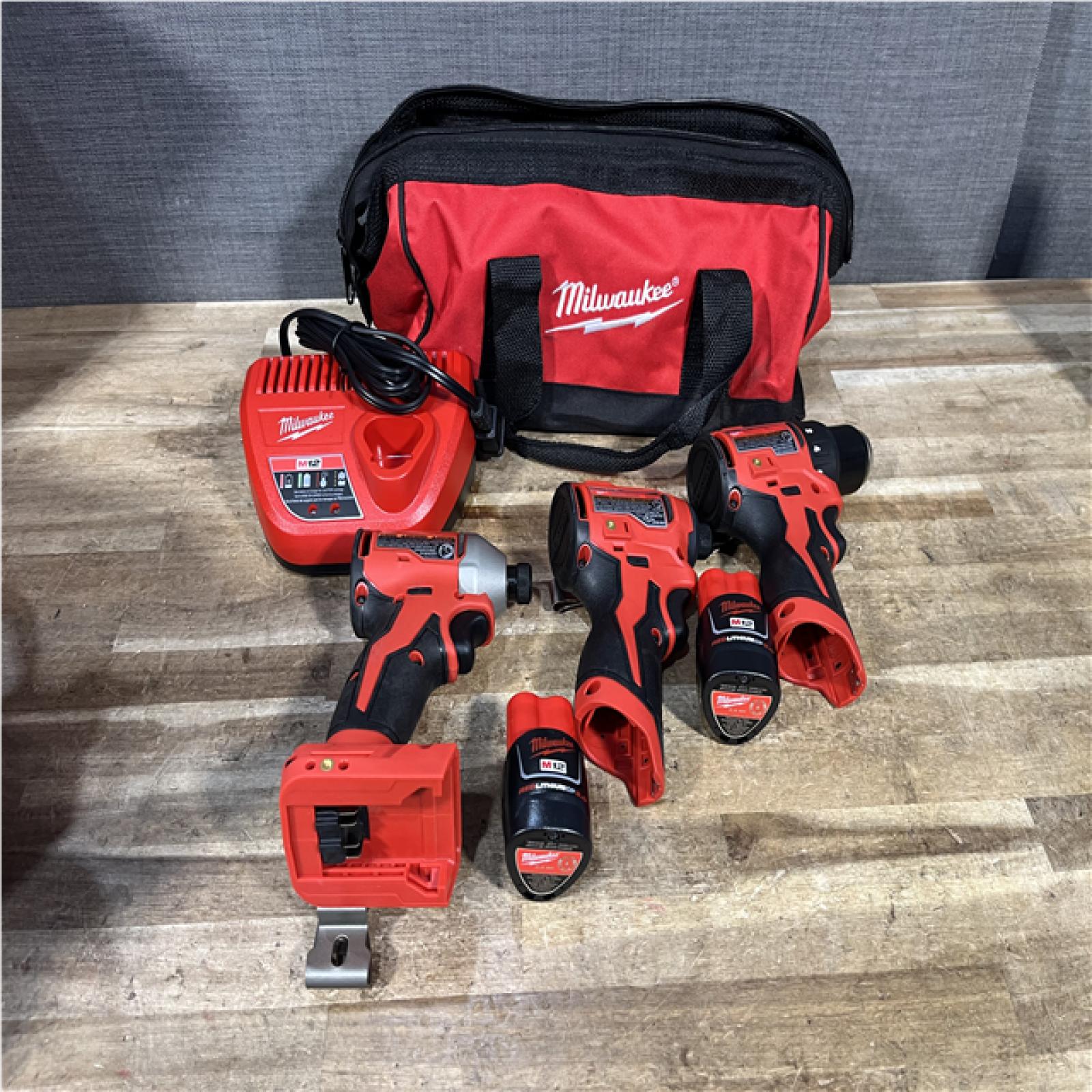 Houston Location AS-IS Milwaukee Drill Driver and Impact Drivers QTY/2 and Batteries with Charger