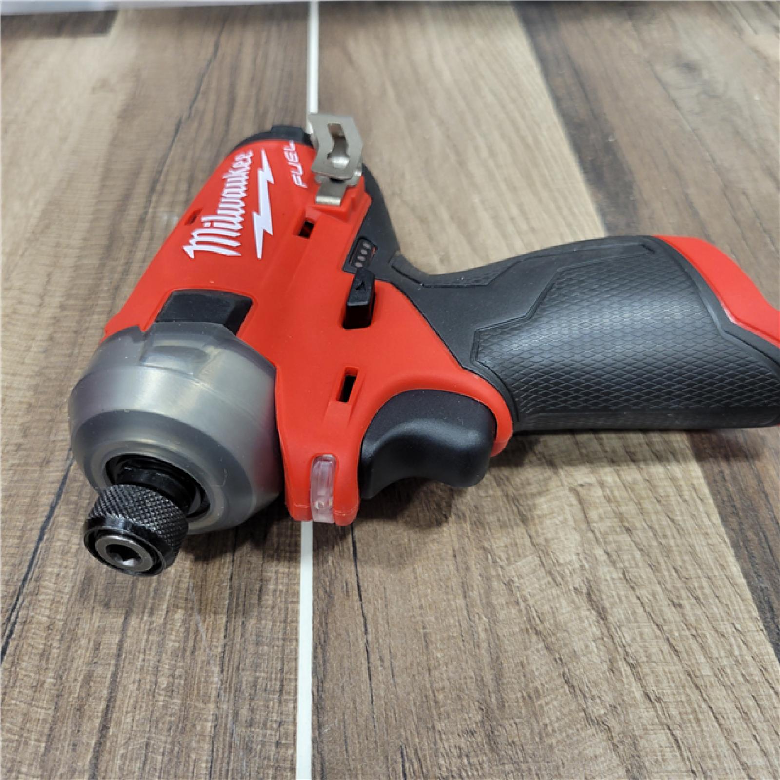 AS-IS Milwaukee 2M12 FUEL SURGE 12V Lithium-Ion Brushless Cordless 1/4 in. Hex Impact Driver Compact Kit W/Two 2.0Ah Batteries, Bag