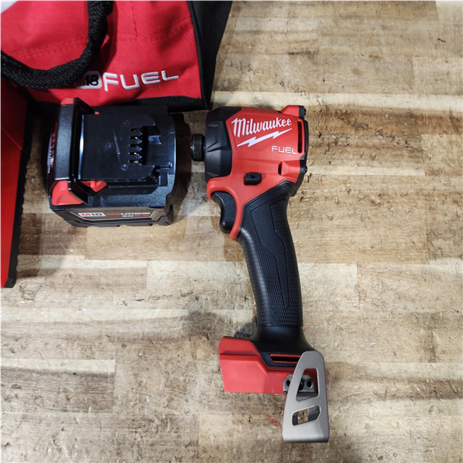 HOUSTON LOCATION - AS - IS Milwaukee  FUEL SURGE 18V Lithium-Ion Brushless Cordless 1/4 in. Hex Impact Driver with (1) 5.0 Ah Battery and Charger