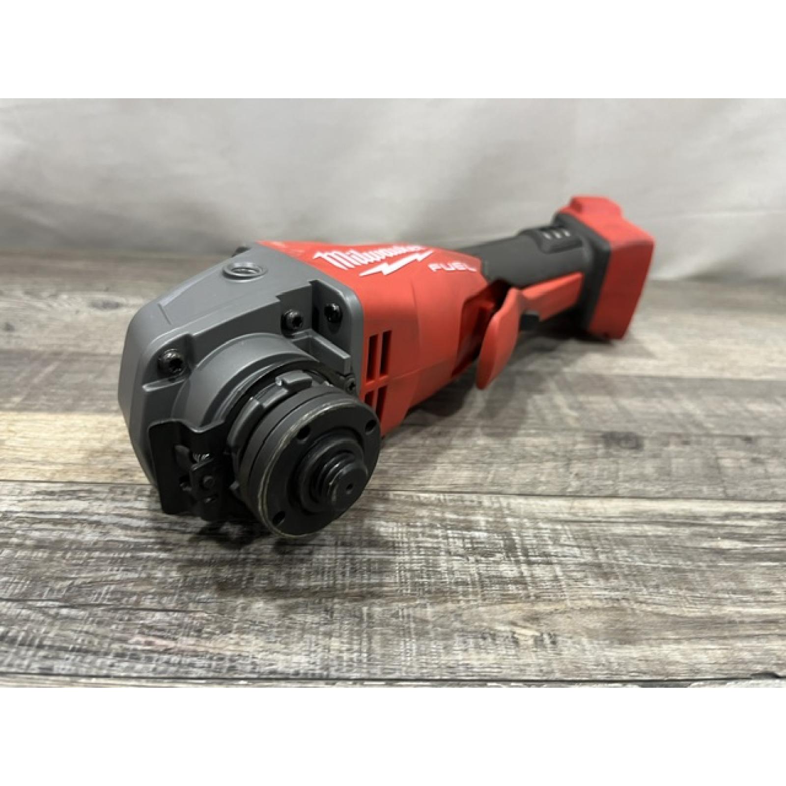 AS-IS Milwaukee FUEL 18V Lithium-Ion Brushless Cordless 4-1/2 in./5 in. Grinder w/Paddle Switch (Tool-Only)