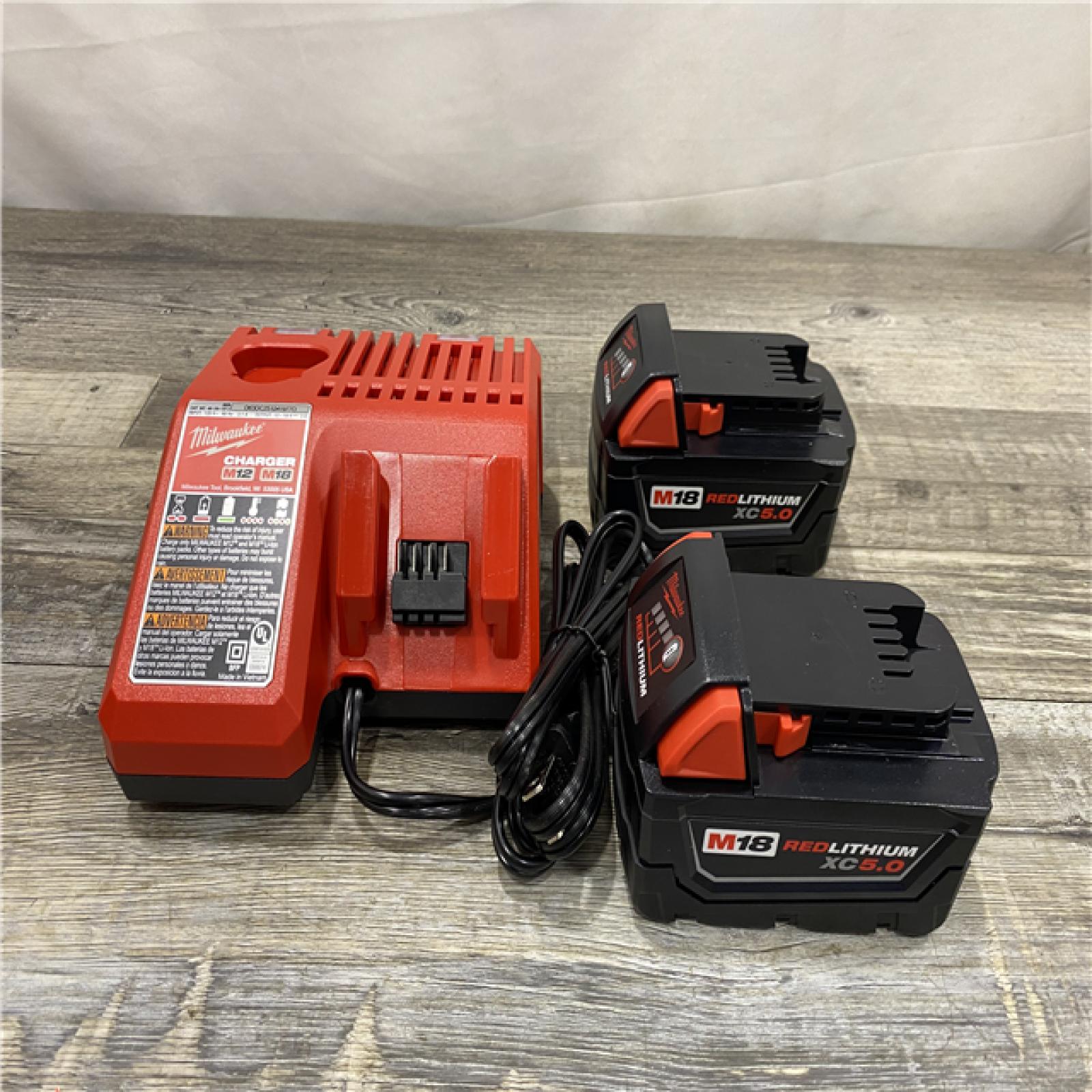 AS-IS Milwaukee 18-Volt Lithium-Ion XC Starter Kit with Two 5.0Ah Batteries and Charger