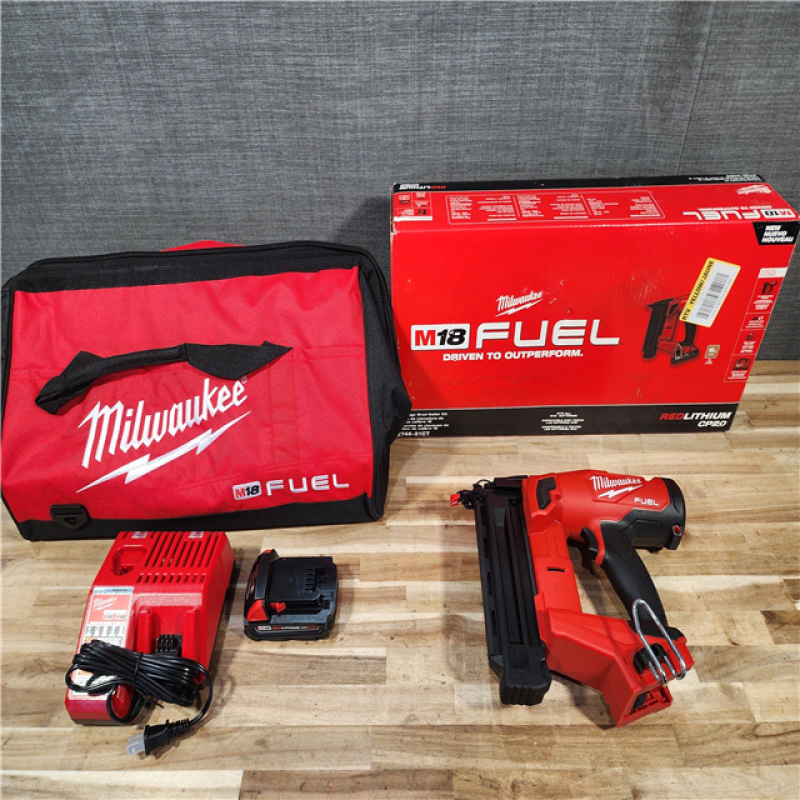 HOUSTON LOCATION - AS-IS (APPEARS LIKE NEW) Milwaukee M18 FUEL GEN II 18V 18-Gauge Lithium-Ion Brushless Cordless Brad Nailer Kit with One 2.0 Ah Battery  Charger and Bag