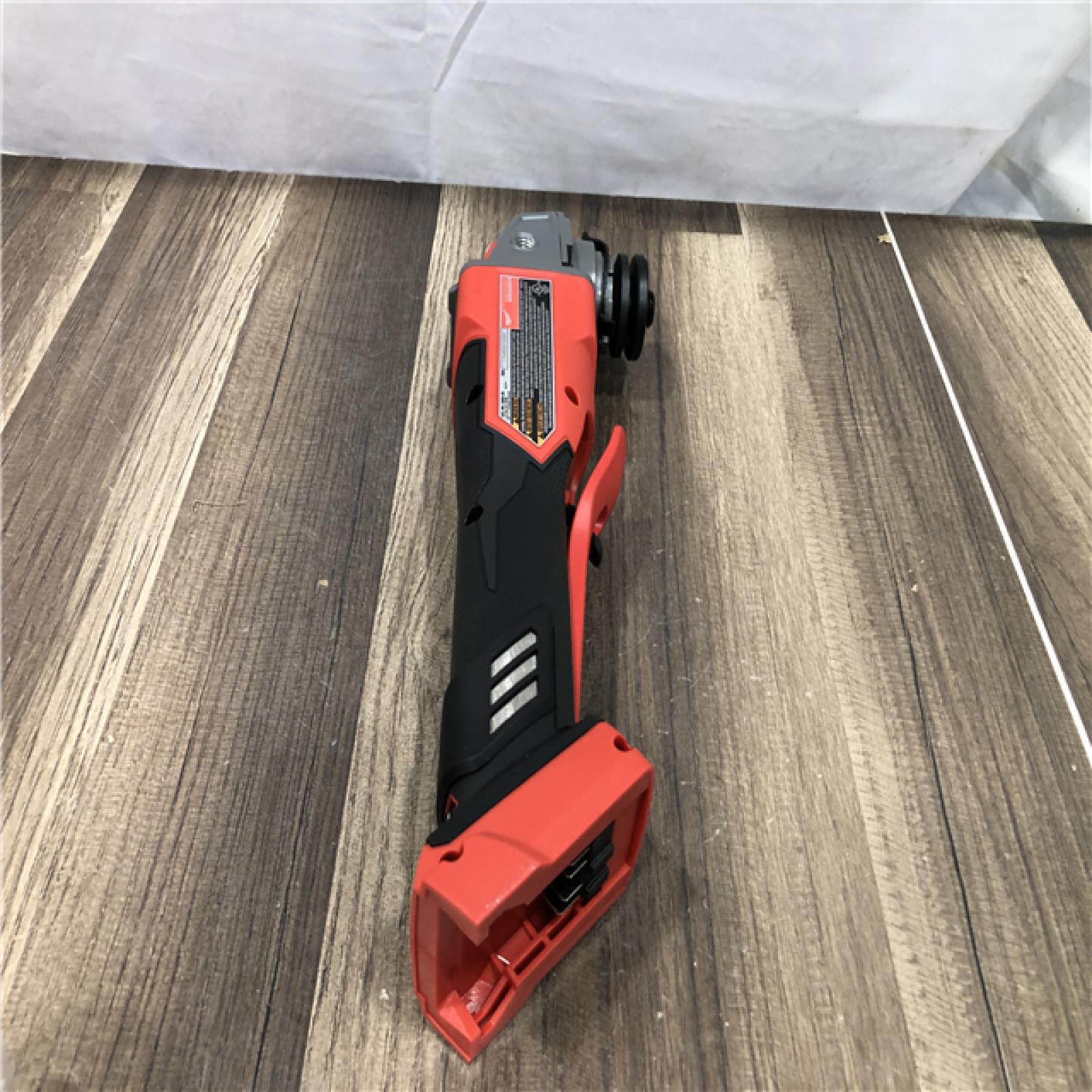 AS-IS Milwaukee FUEL 18V Lithium-Ion Brushless Cordless 4-1/2 in./5 in. Grinder with Variable Speed & Paddle Switch (Tool-Only)