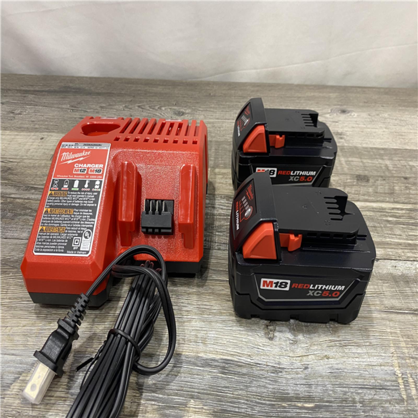 AS-IS Milwaukee 18-Volt Lithium-Ion XC Starter Kit with Two 5.0Ah Batteries and Charger