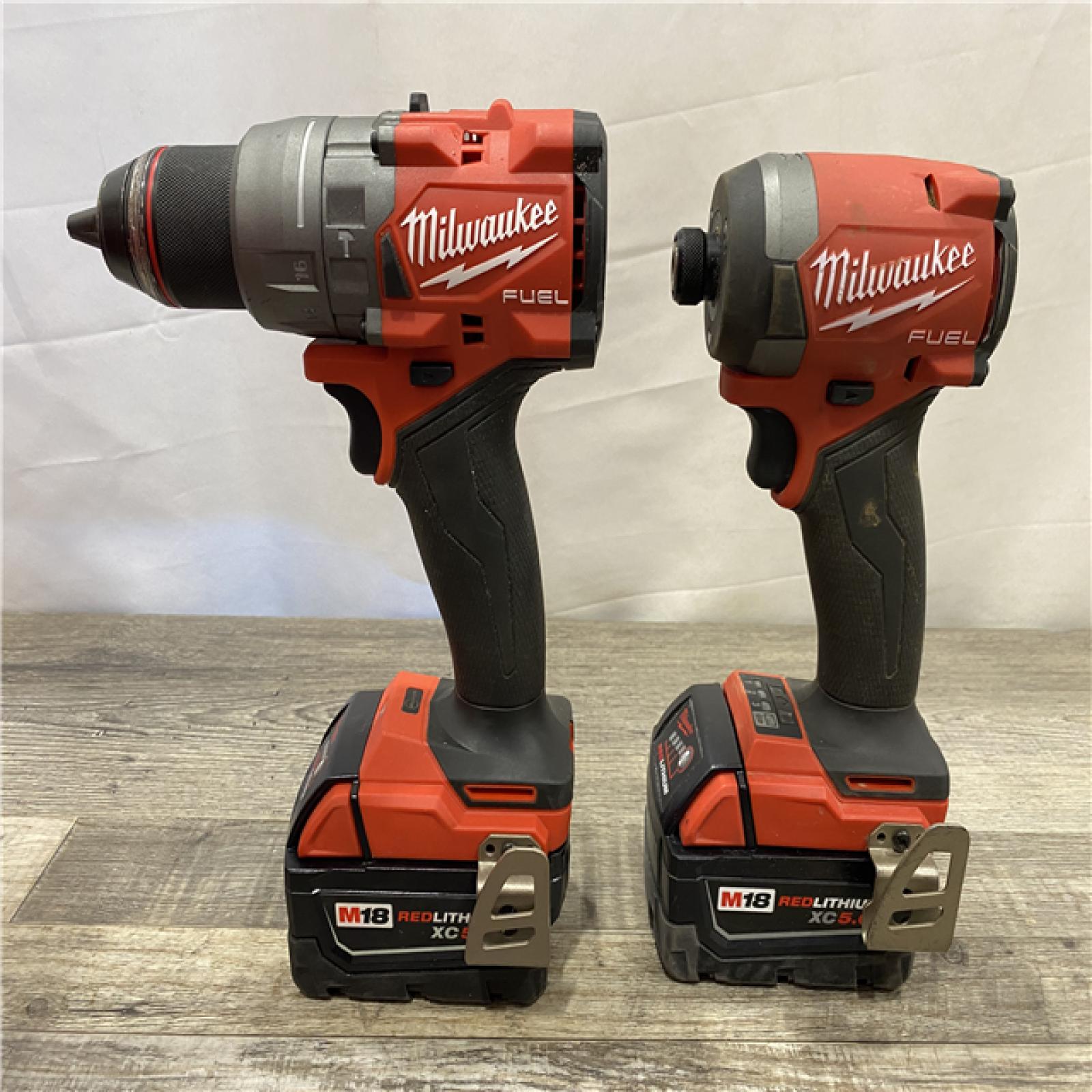 AS-IS Milwaukee FUEL 18V Lithium-Ion Brushless Cordless Hammer Drill and Impact Driver Combo Kit