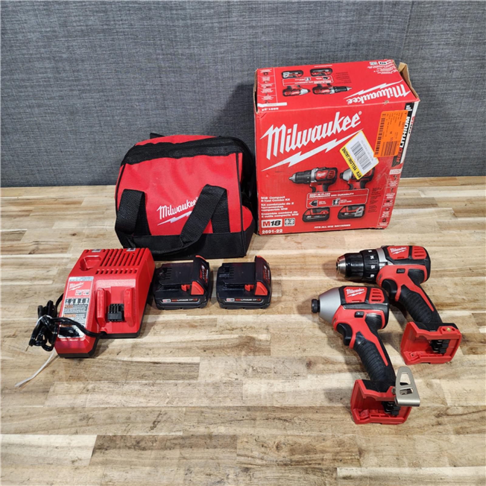 HOUSTON LOCATION - AS-IS Milwaukee M18 18V Lithium-Ion Cordless Drill Driver/Impact Driver Combo Kit