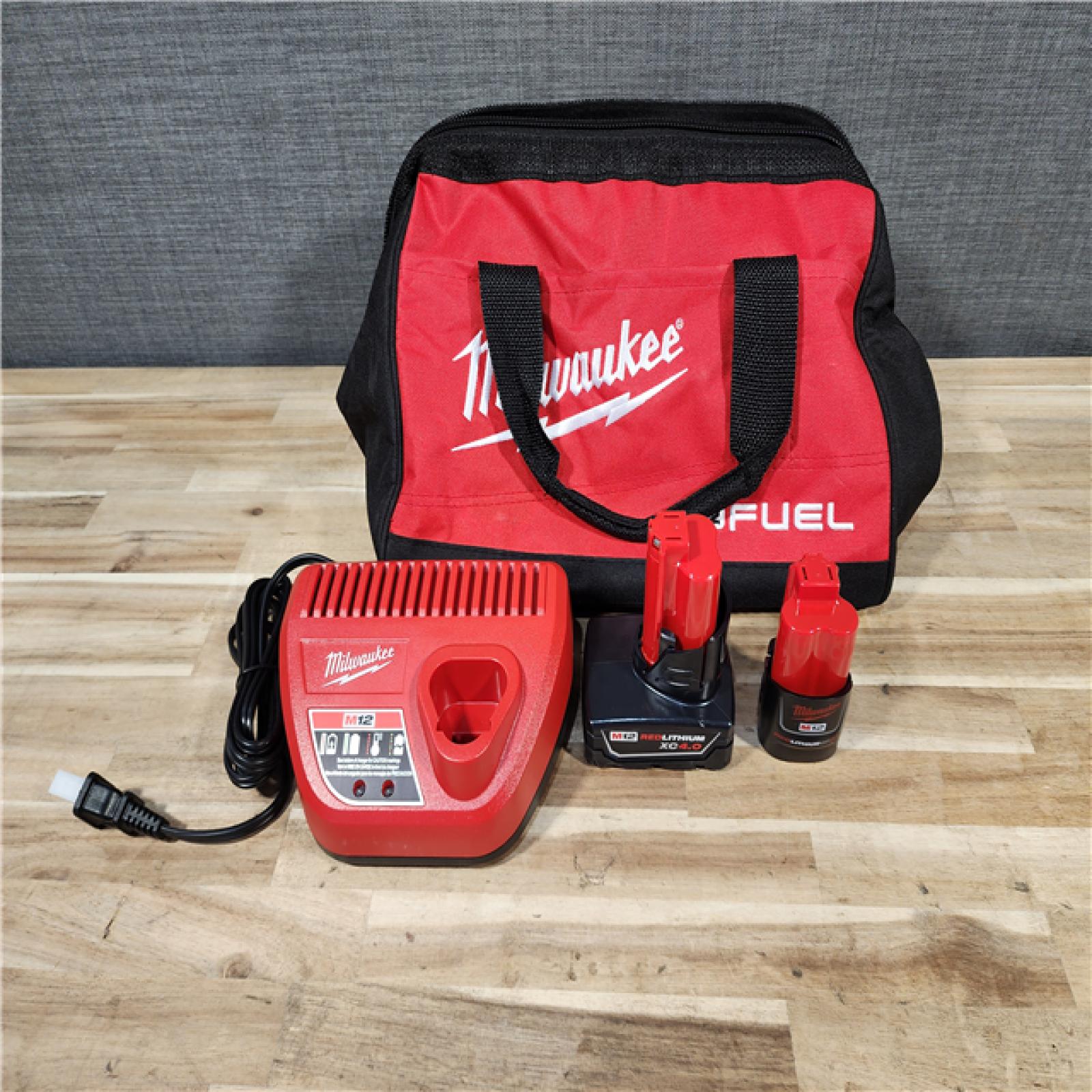 HOUSTON LOCATION - AS-IS Milwaukee FUEL 12-Volt Lithium-Ion Brushless Cordless Hammer Drill and Impact Driver Combo Kit