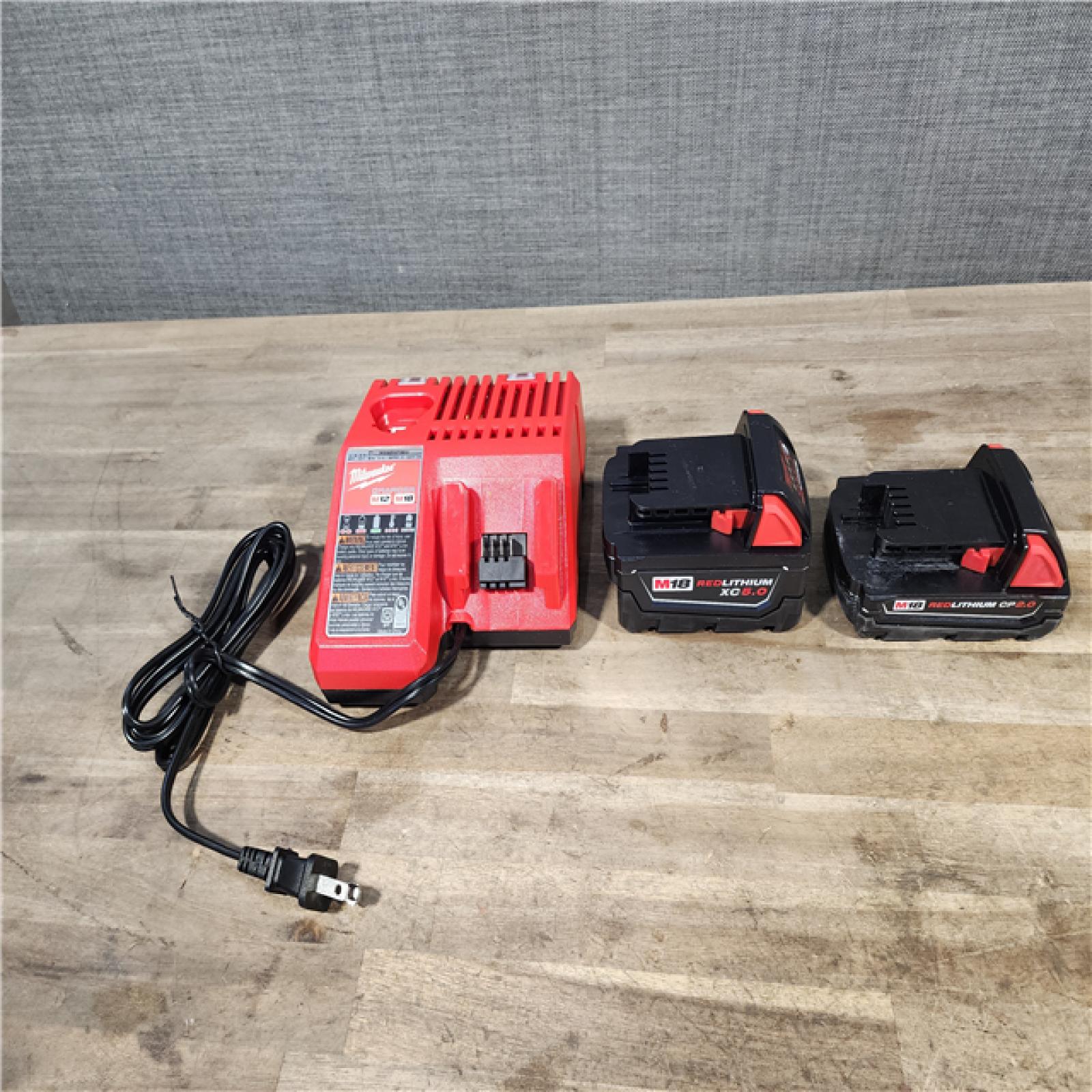 HOUSTON LOCATION - AS-IS MILWAUKEE 2 TOOL COMBO KIT W/ (2) BATTERY & CHARGER