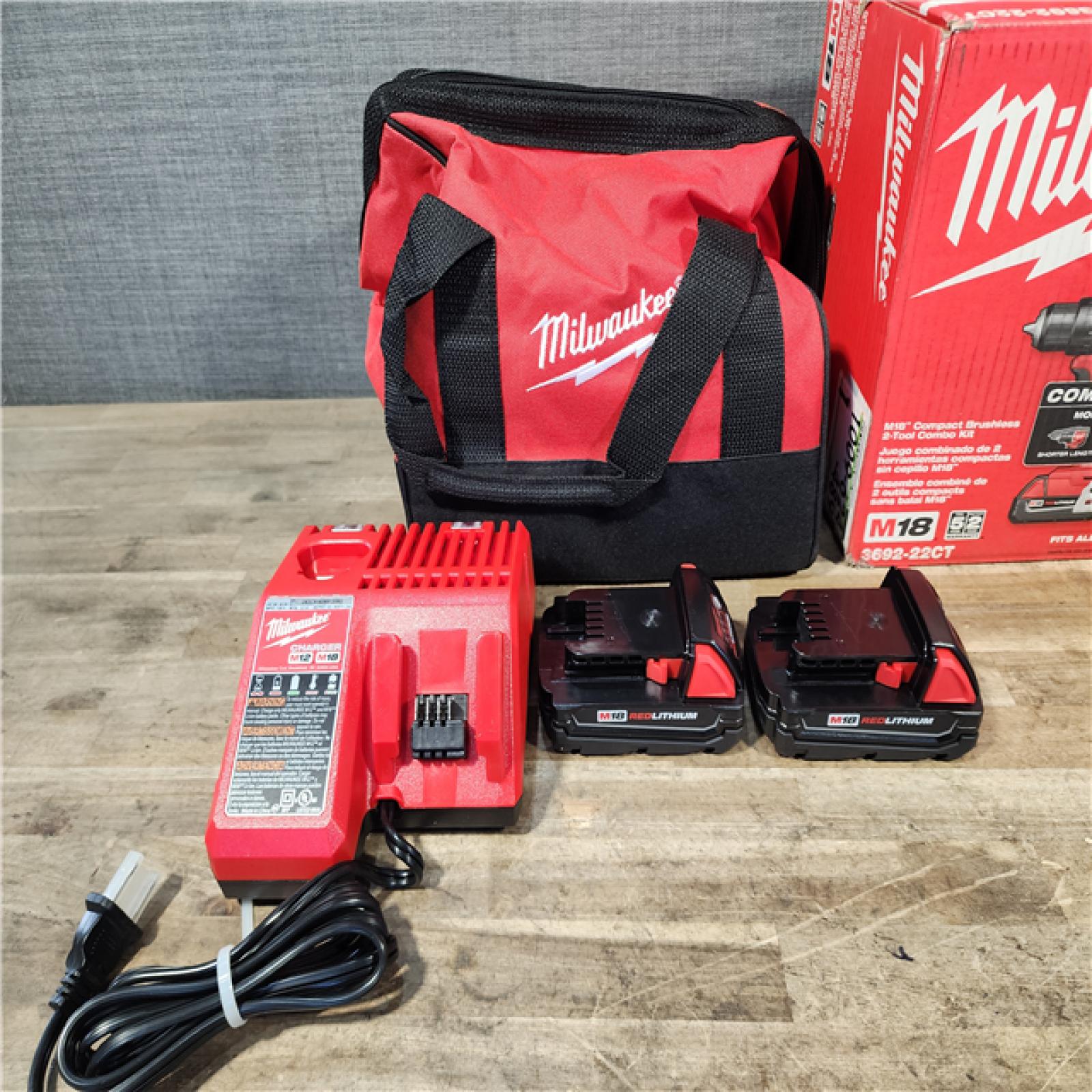 HOUSTON LOCATION - AS-IS Milwaukee M18 18V Lithium-Ion Brushless Cordless Compact Drill/Impact Combo Kit (2-Tool) W/(2) 2.0 Ah Batteries  Charger & Bag